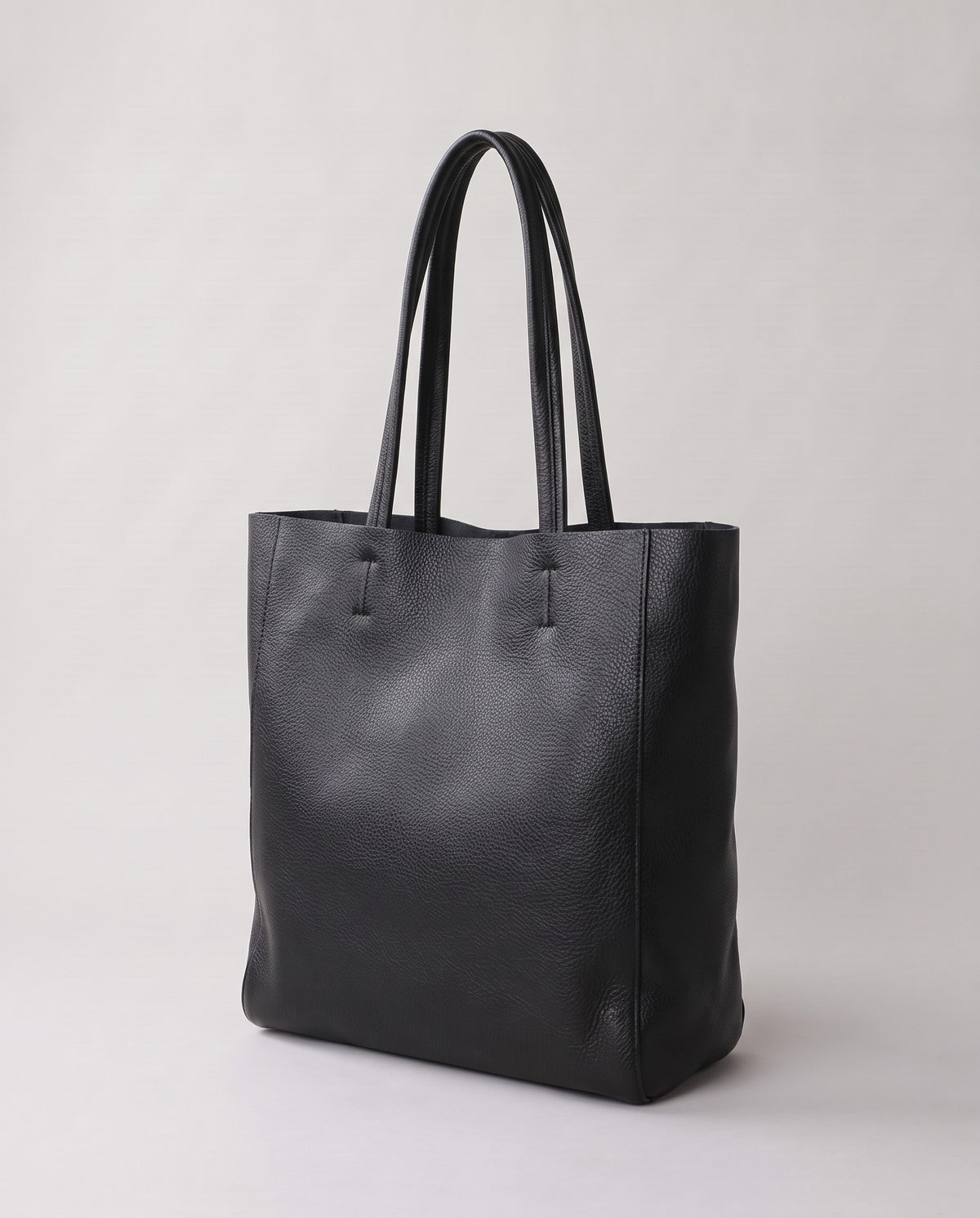 Costa leather tote in black, three-quarter view