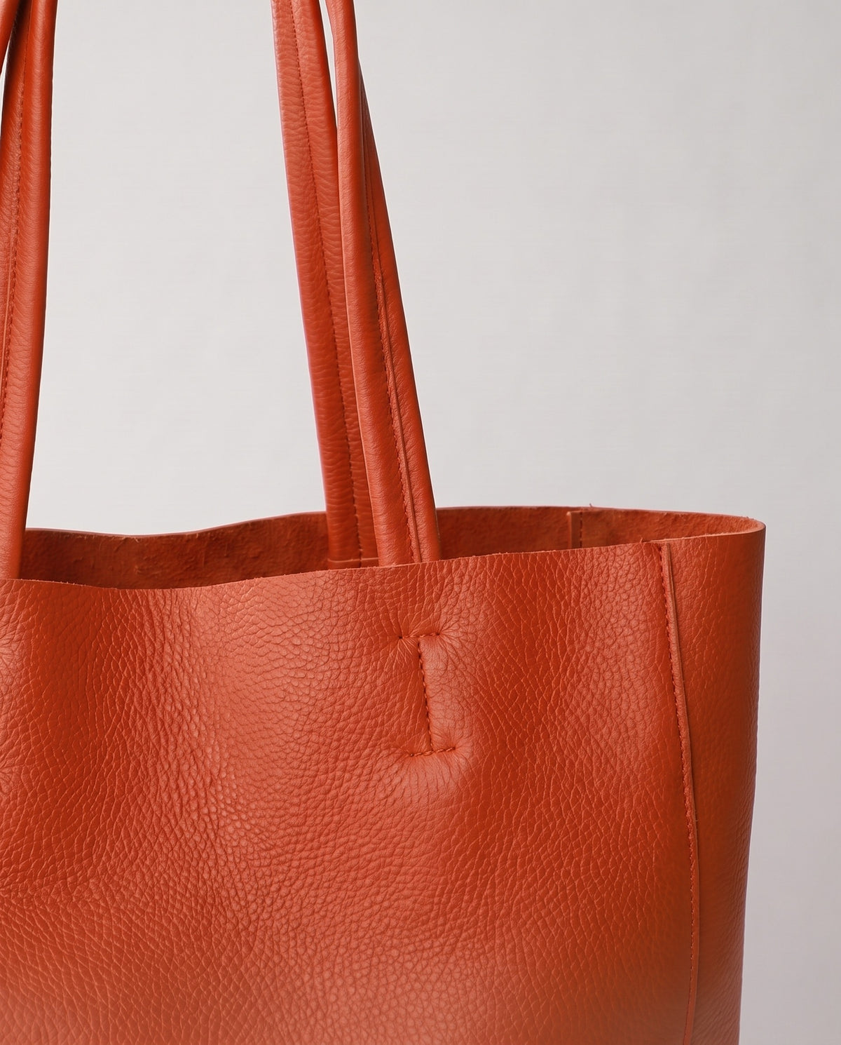 Costa leather tote in caramel, hardware and leather detail