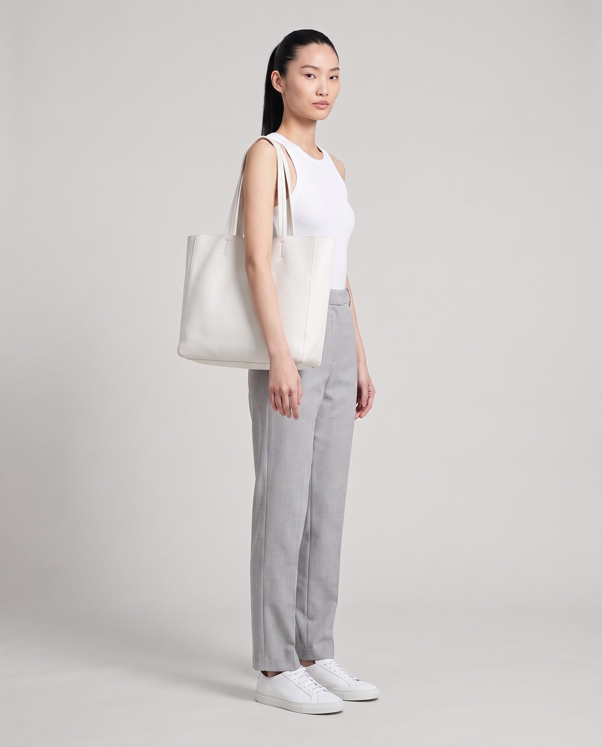 Model with the Costa leather tote in chalk, full length