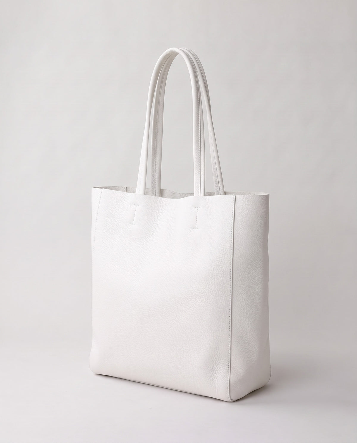 Costa leather tote in chalk, three-quarter view