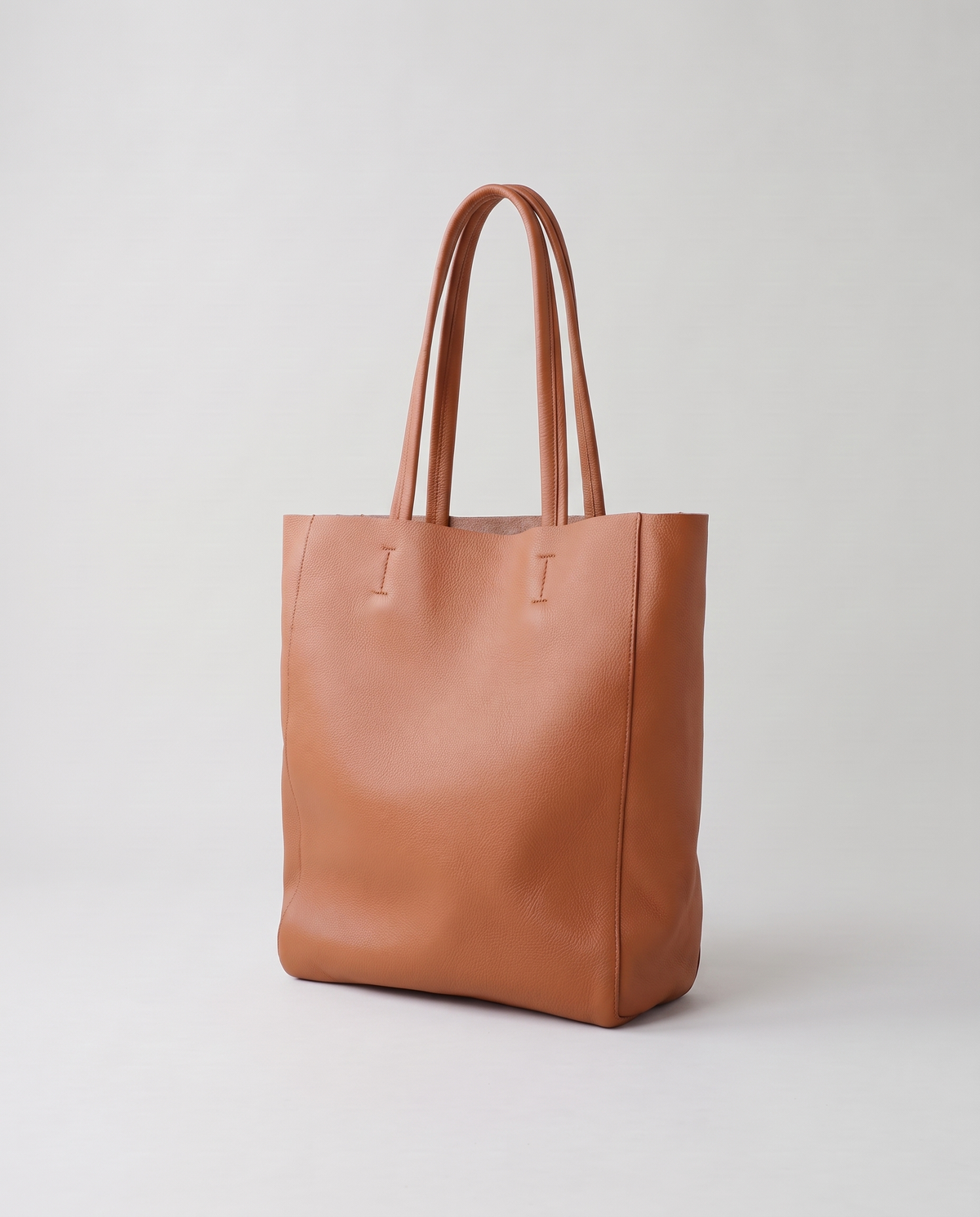 Costa leather tote in cognac, three-quarter view