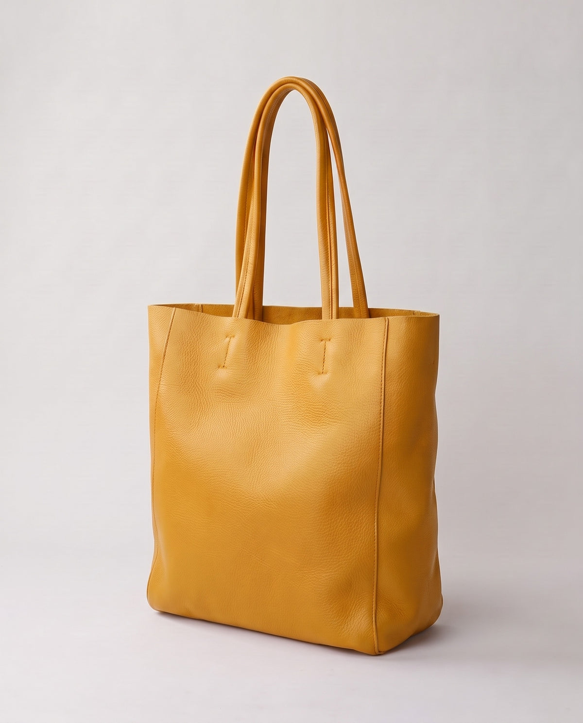 Costa leather tote in mustard, three-quarter view