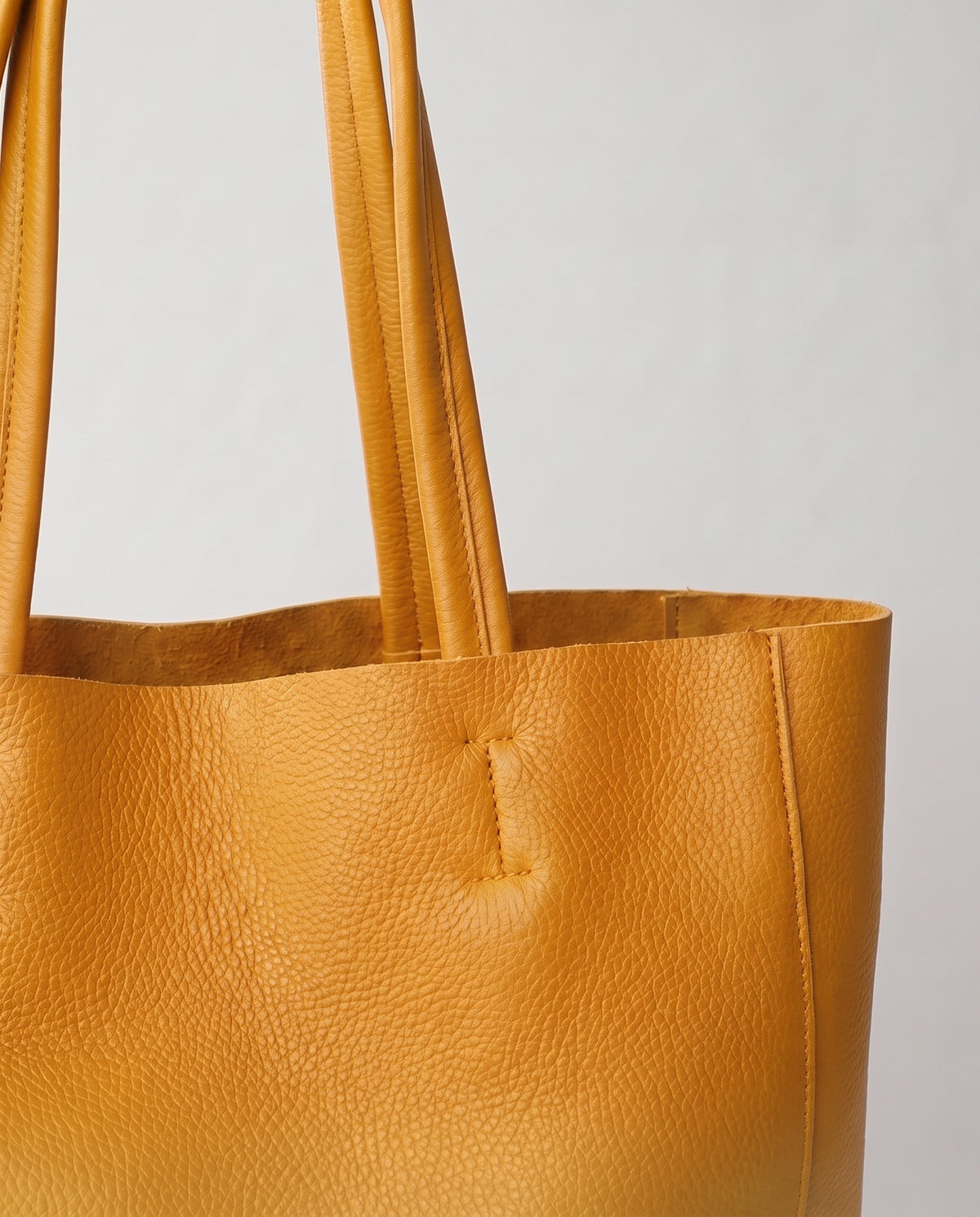 Costa leather tote in mustard, hardware and leather detail