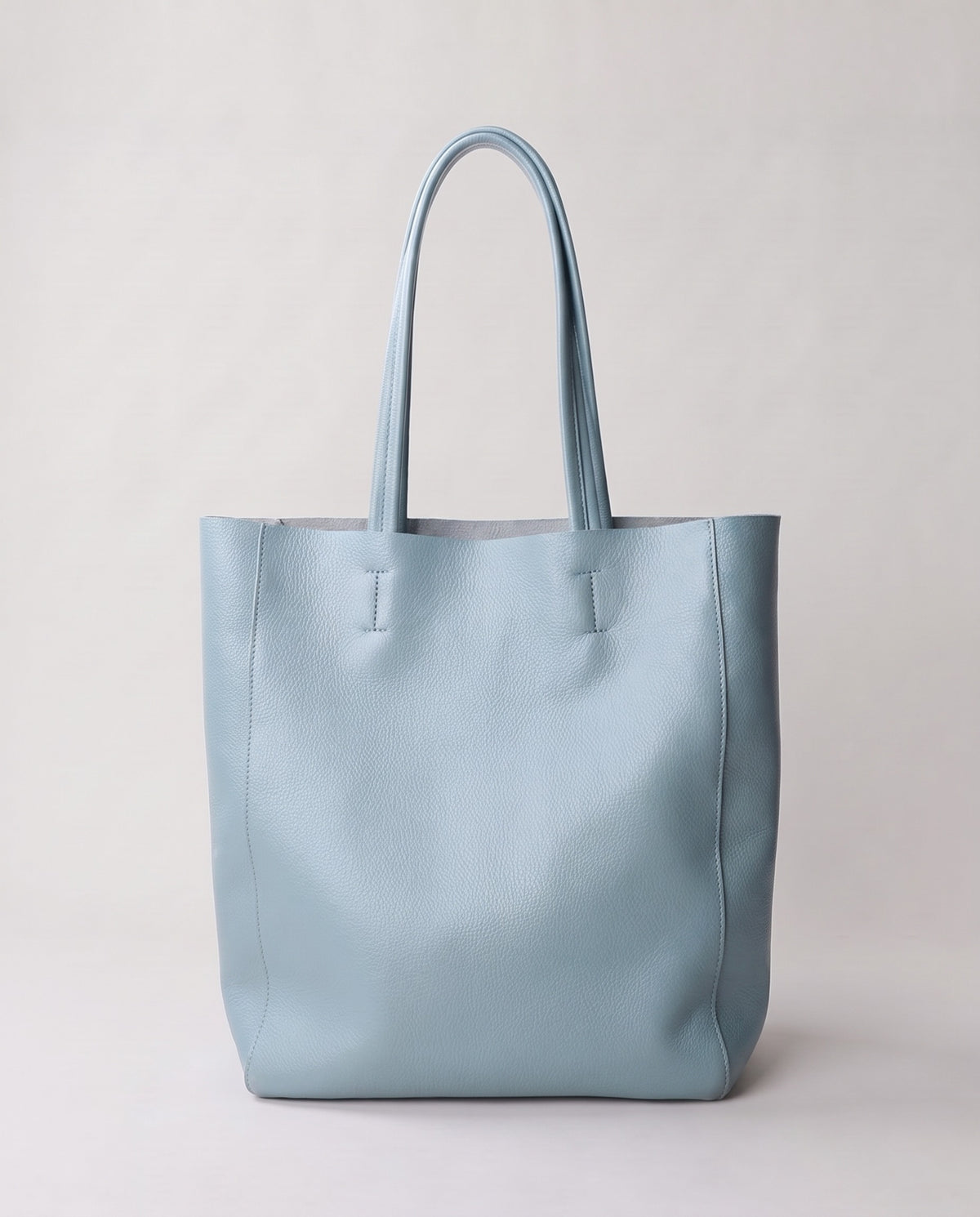 Costa leather tote in sky, back view
