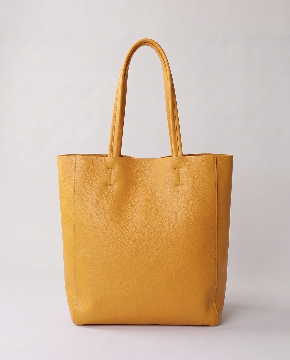 Costa leather tote in yellow, back view