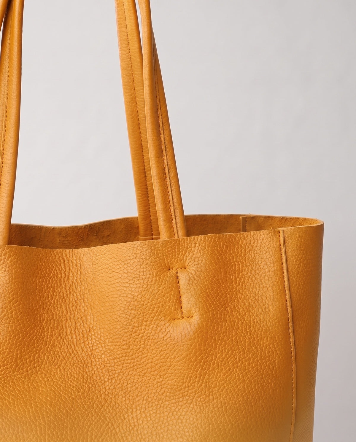 Costa leather tote in yellow, hardware and leather detail