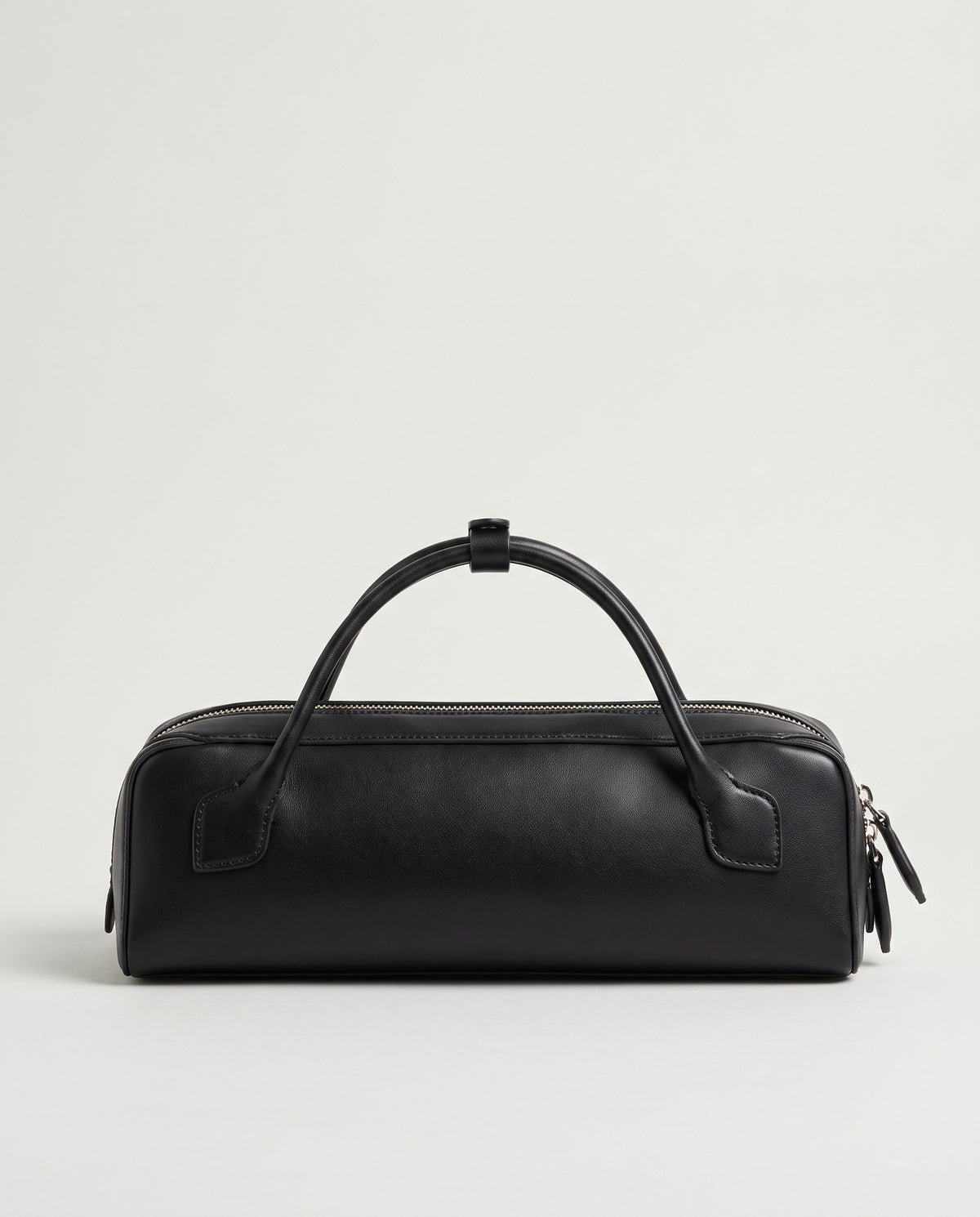 Curve leather barrel bag in Black – back view