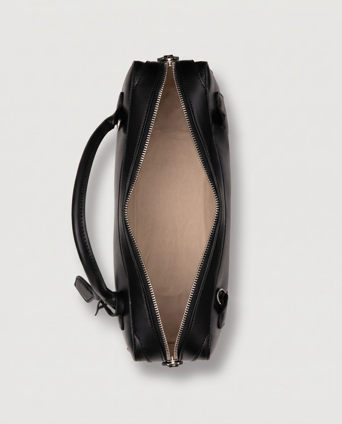 Curve leather barrel bag in Black – inside view with the zip open