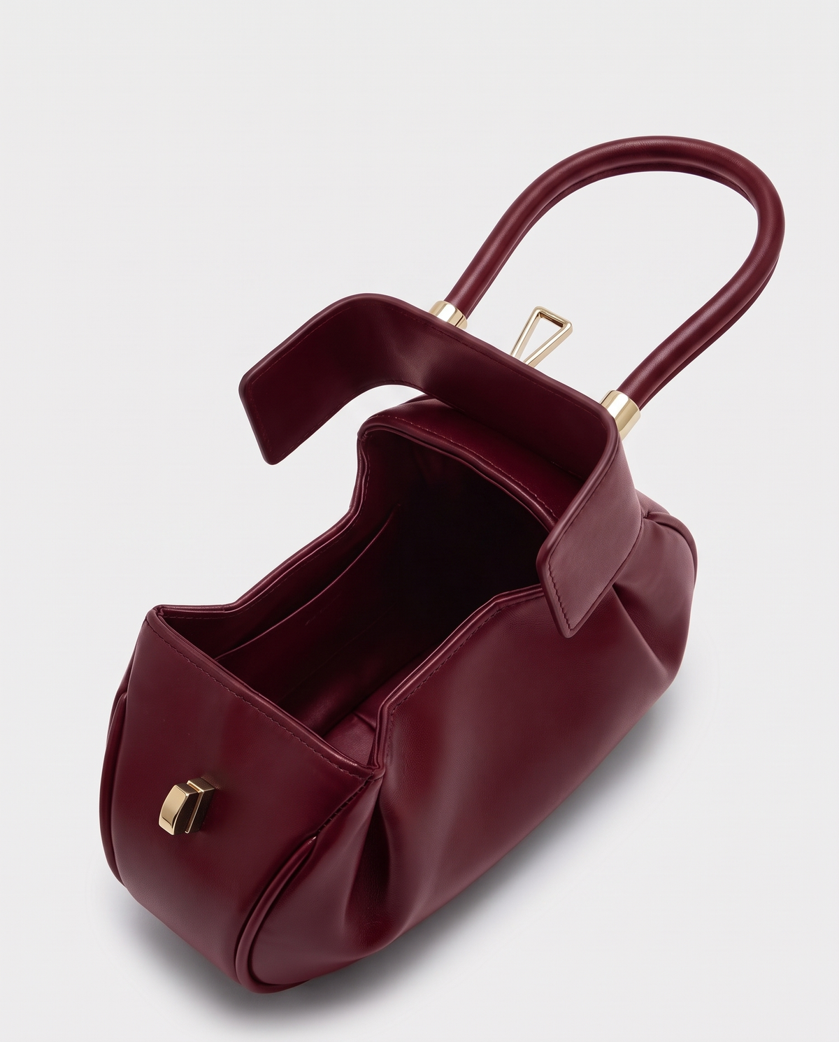 Dumpling Maxi leather top-handle bag in Red – open, showing the leather-lined interior