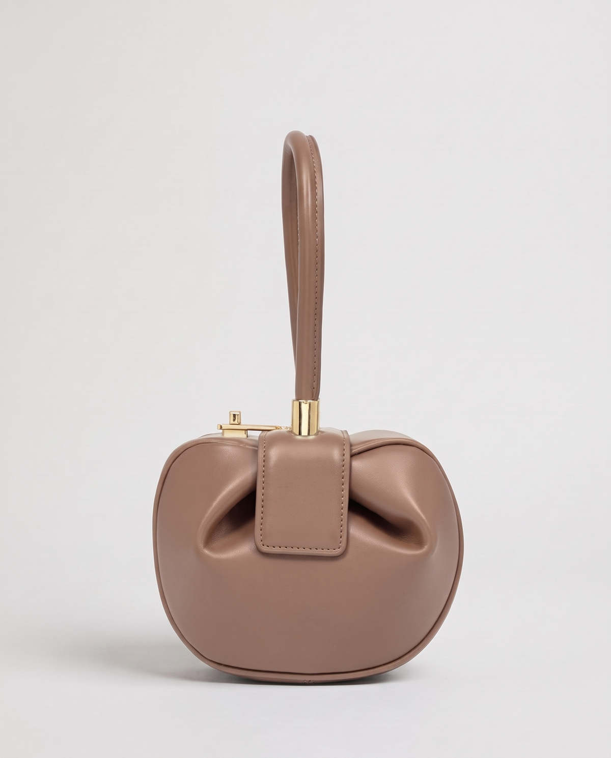 Dumpling Mini leather top-handle bag in Nude – front view
