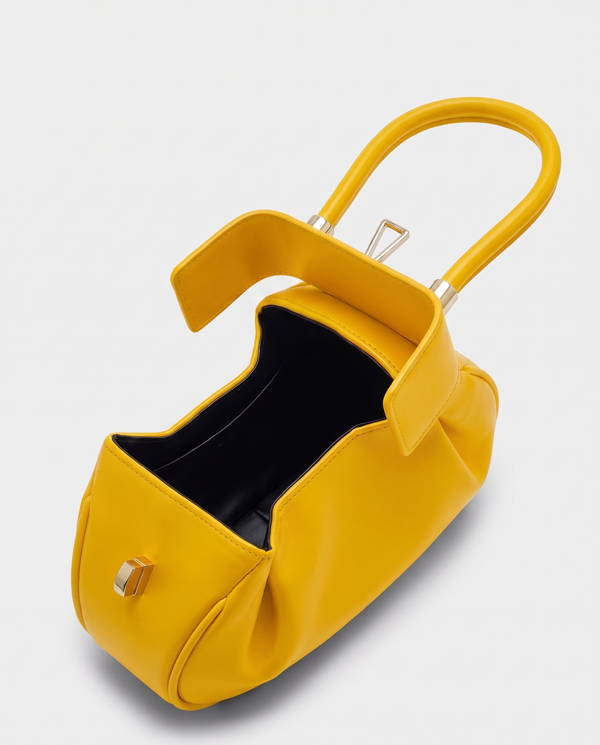 Dumpling Mini leather top-handle bag in Yellow – open, showing the leather-lined interior