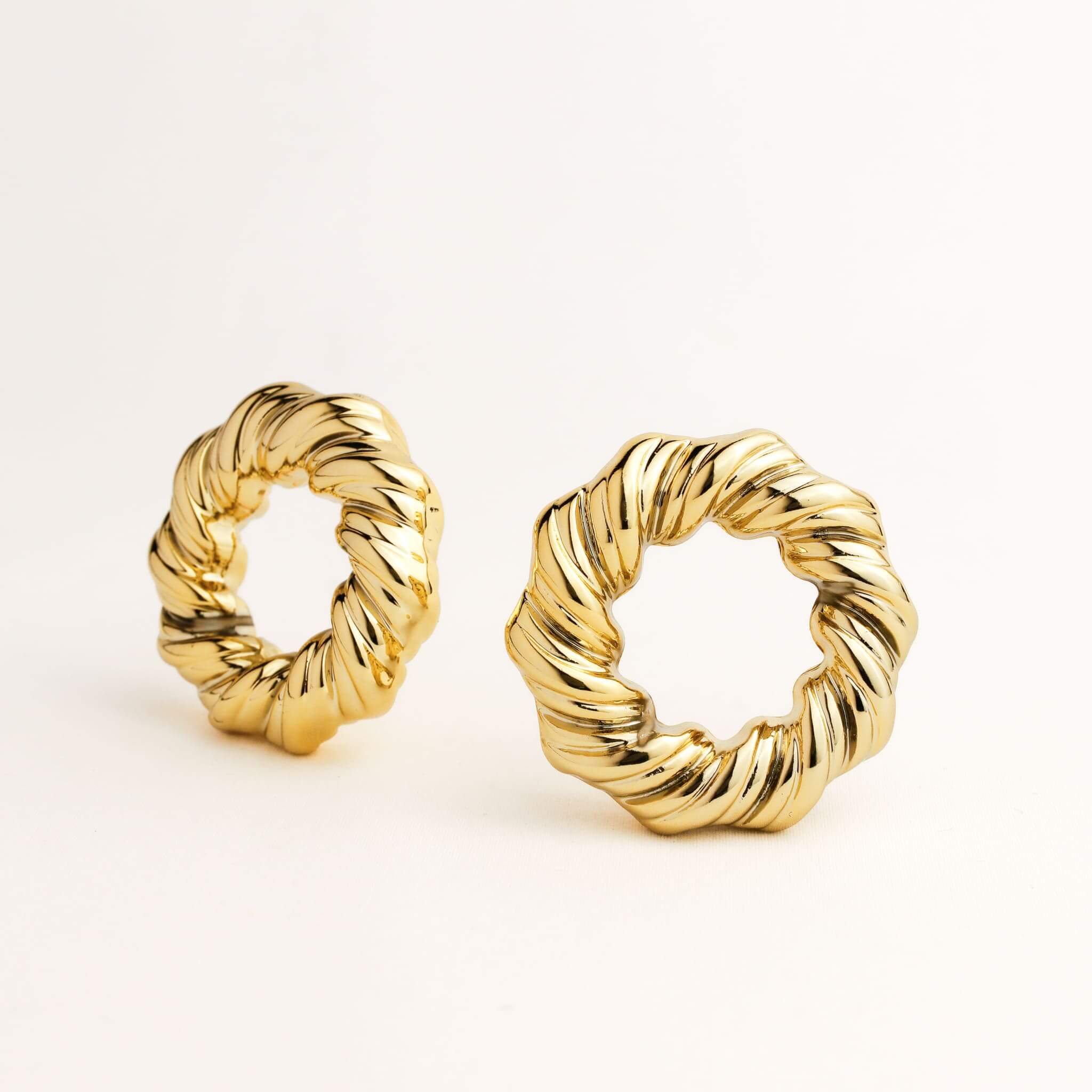 A pair of gold hoop earrings