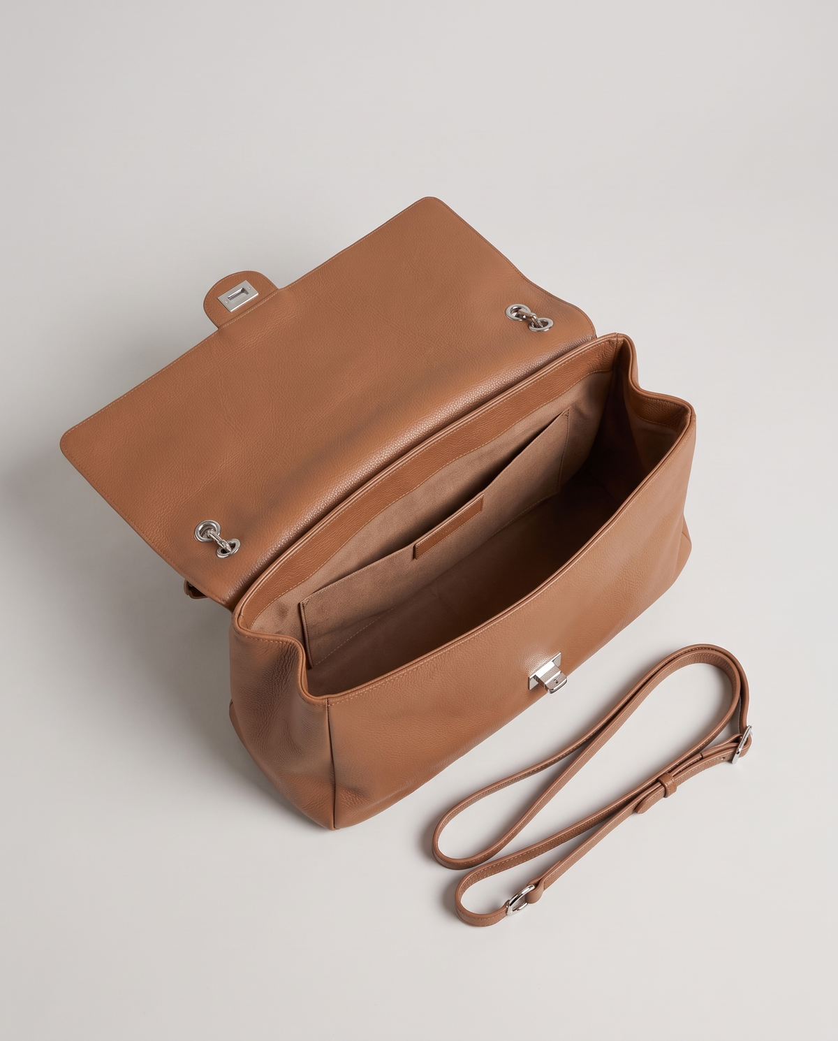 Fiume leather shoulder bag in caramel, open showing interior