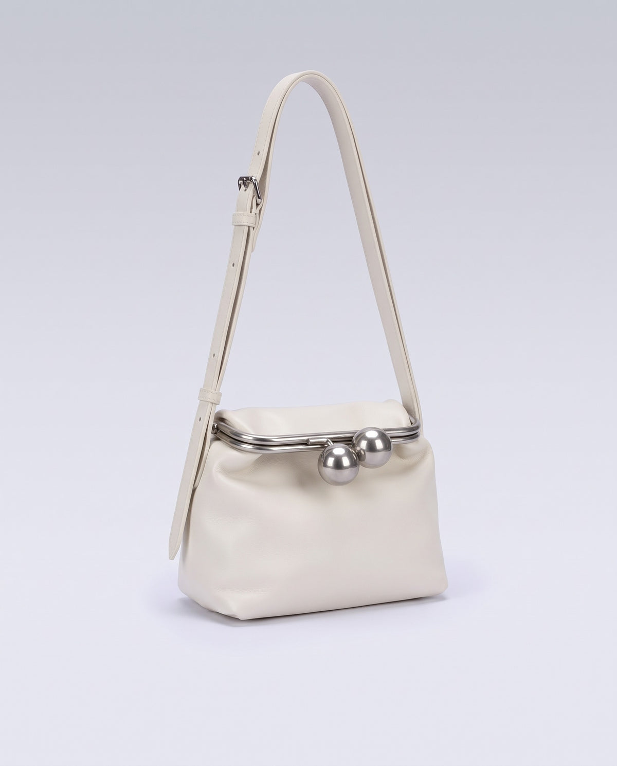 Garda leather frame bag in Ivory – three-quarter view