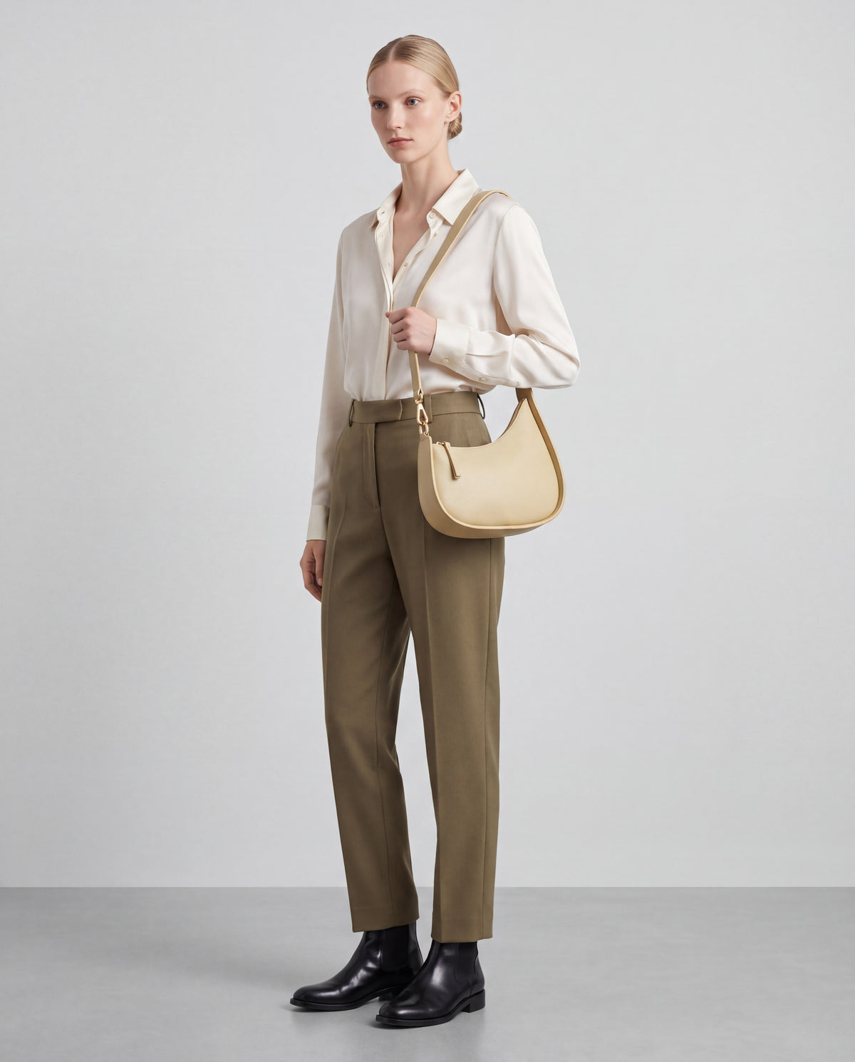Muse bag in Beige – worn by model, full length