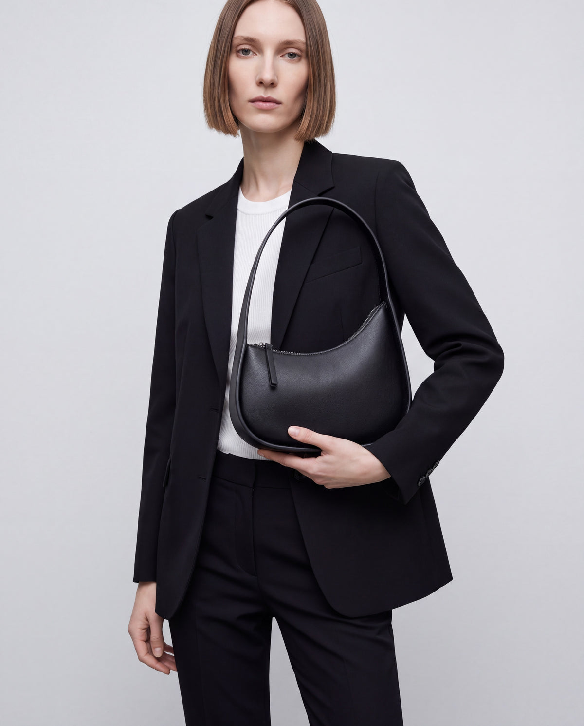 Muse bag in Black – worn by model, close-up