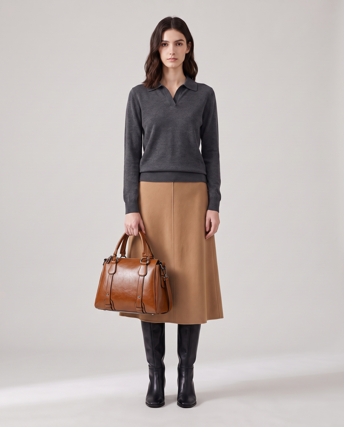 Harlow leather handbag in Brown – model holding it by the top handles, full length
