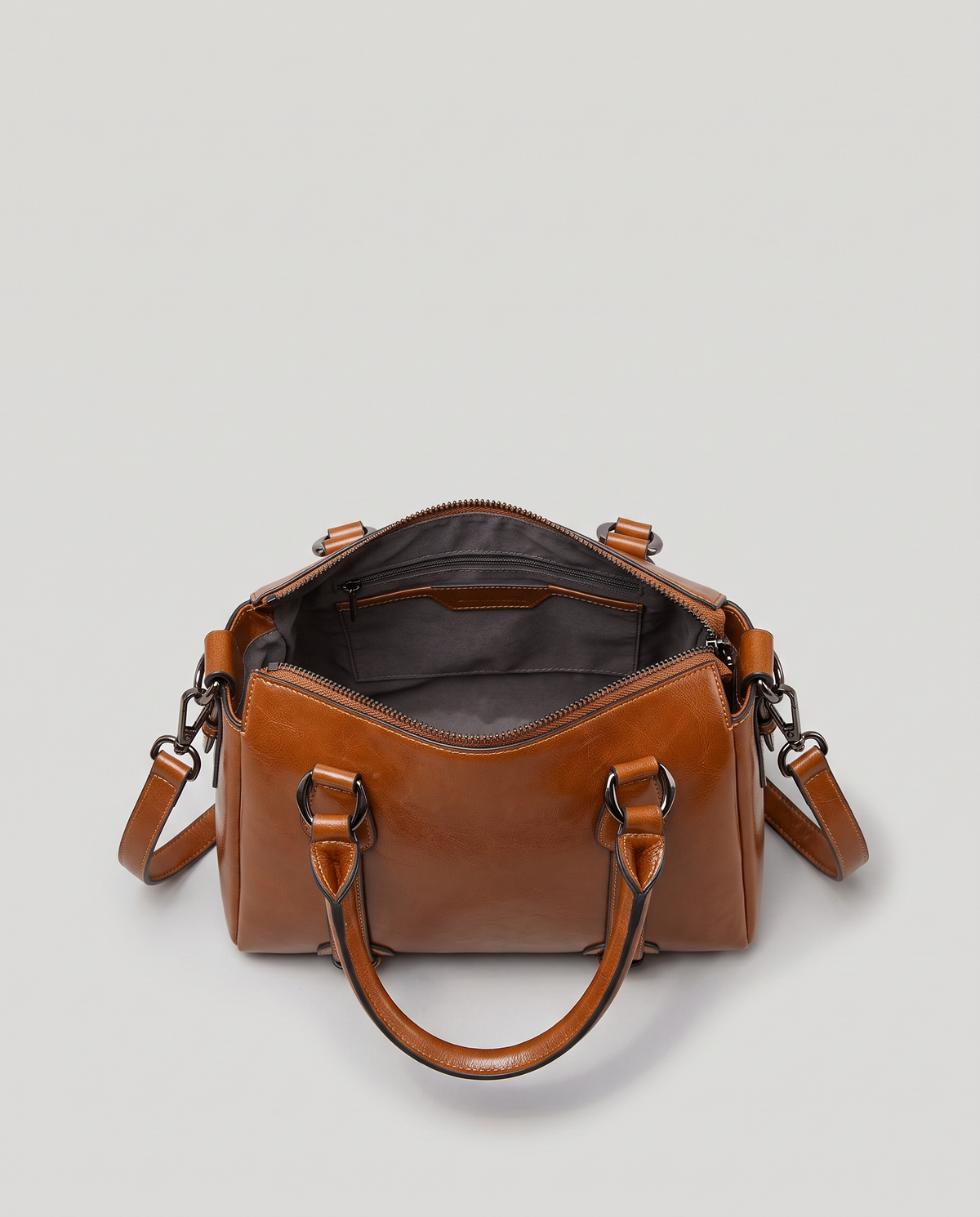 Harlow leather handbag in Brown – view from above with the zip open, showing the lined interior