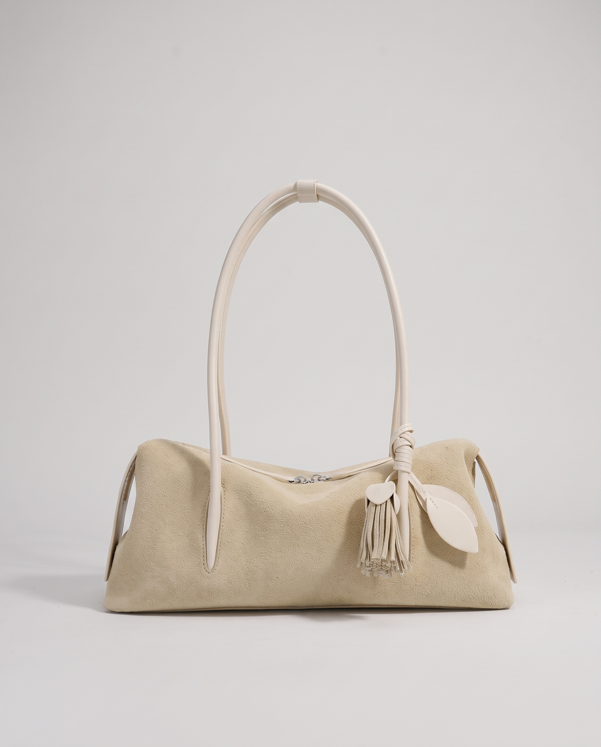 Isola suede shoulder bag in beige, front view