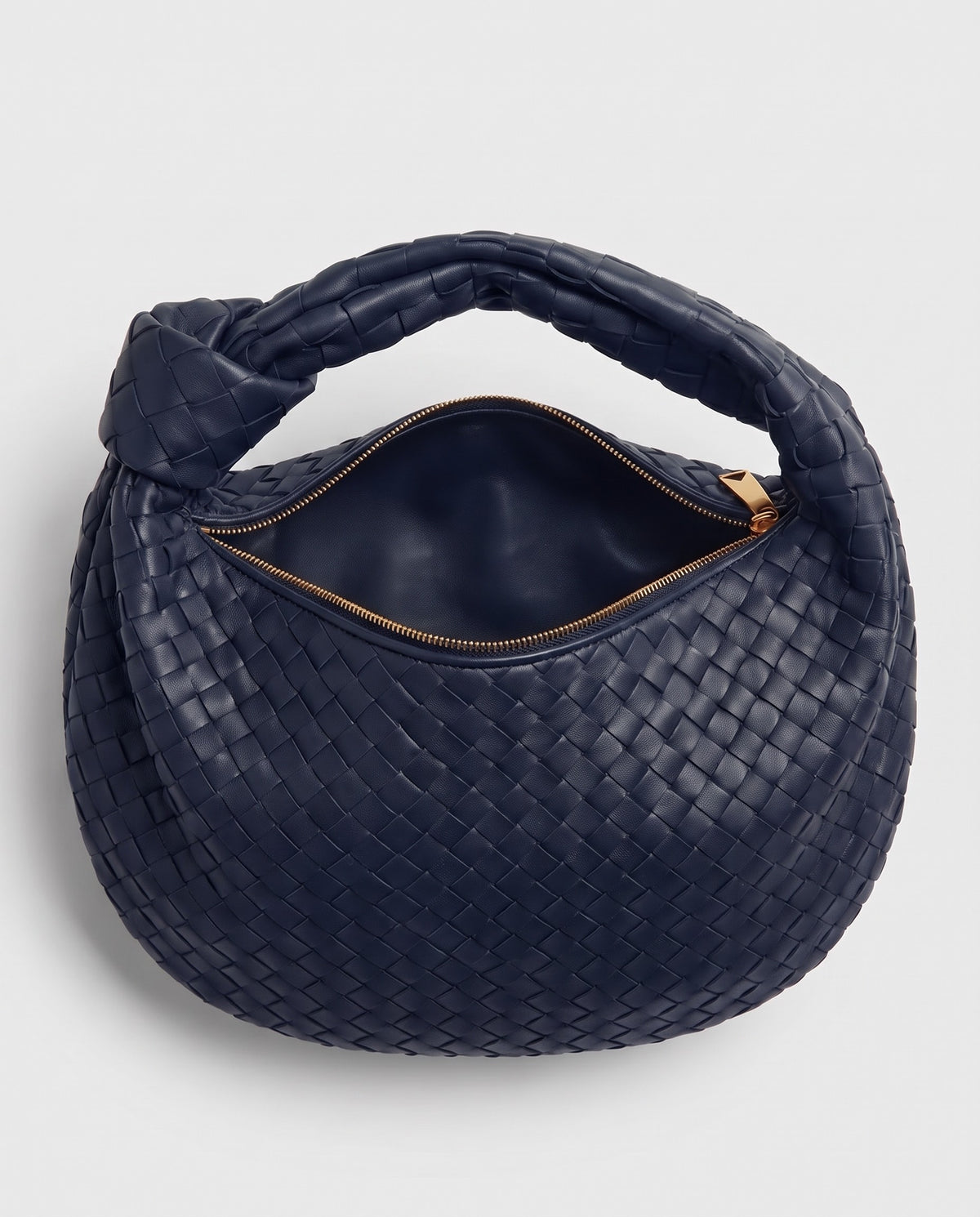 Knot Midi woven leather bag in Navy – inside view with the zip open