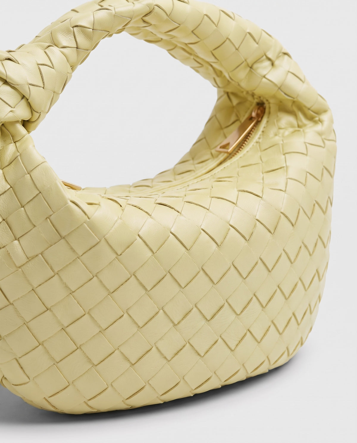 Knot Midi woven leather bag in Yellow – close-up of the woven leather