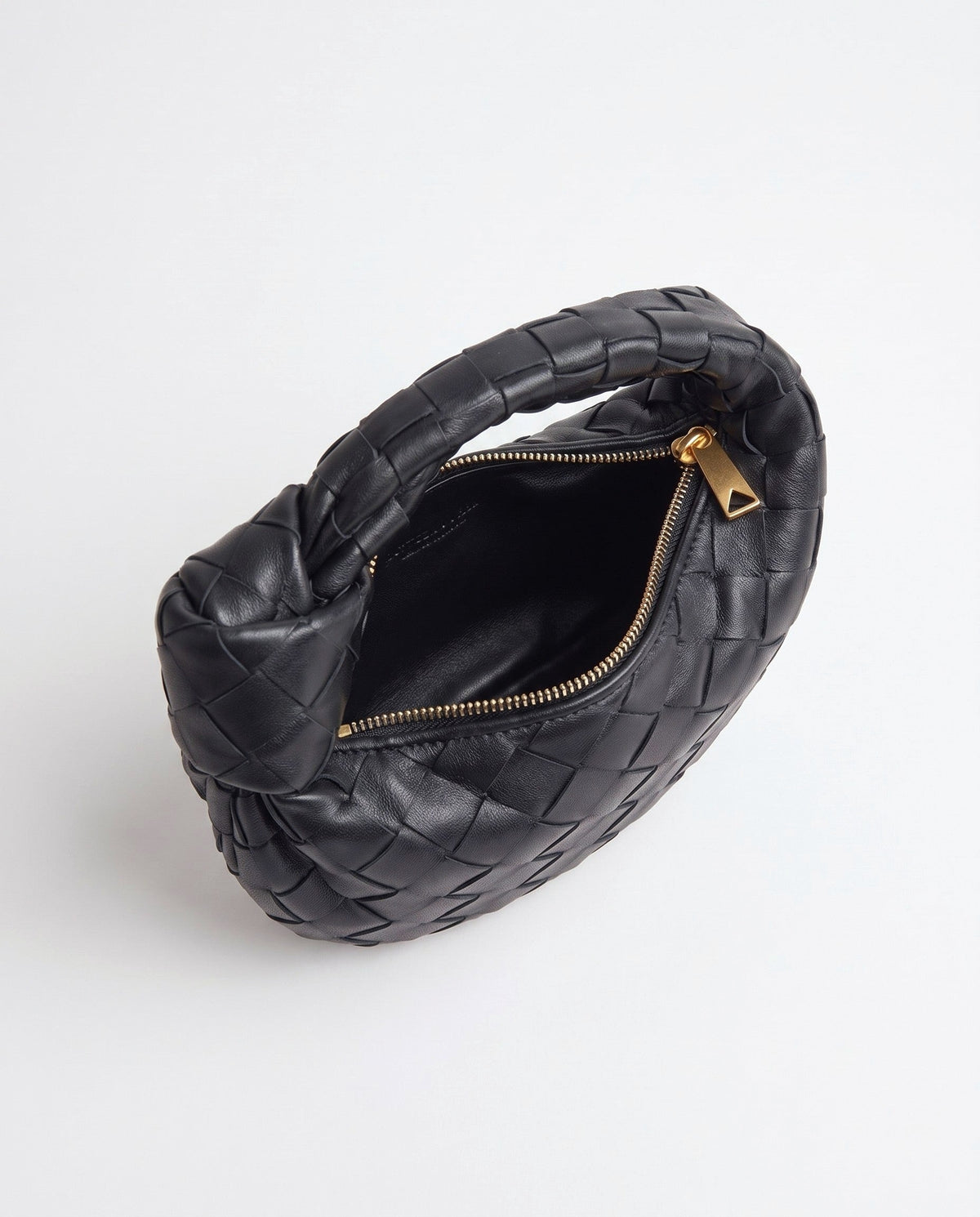 Knot Mini woven leather bag in Black – inside view with the zip open