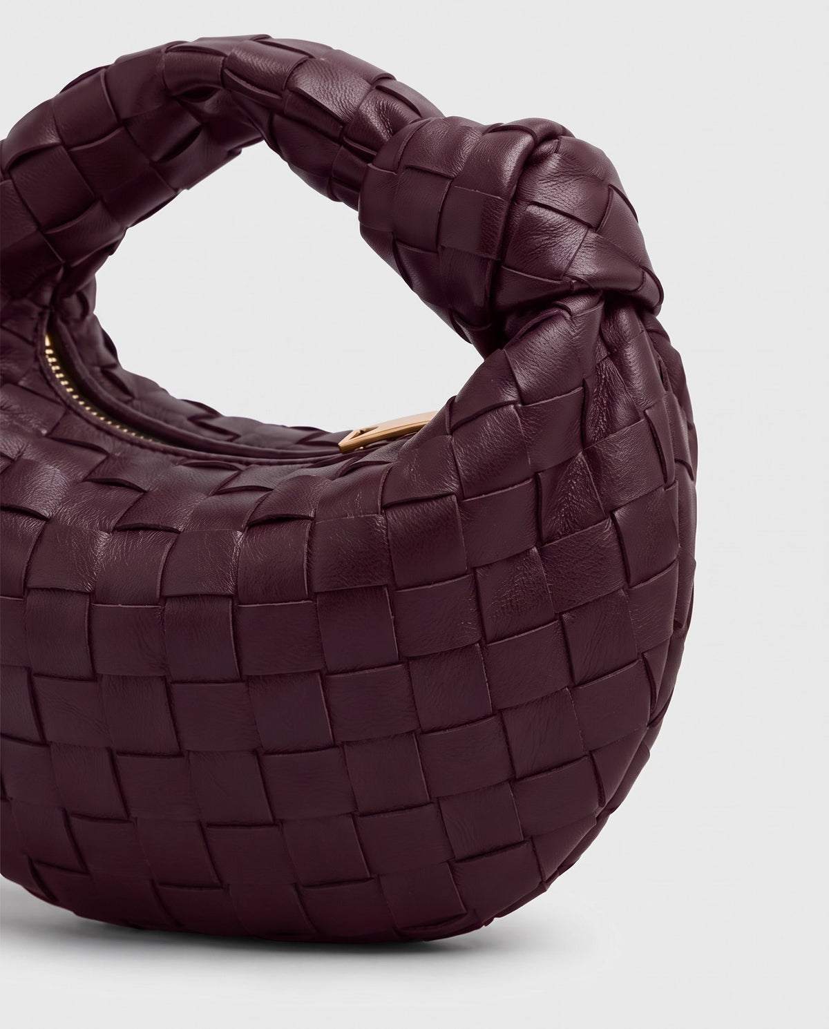 Knot Mini woven leather bag in Bordeaux – close-up of the woven leather