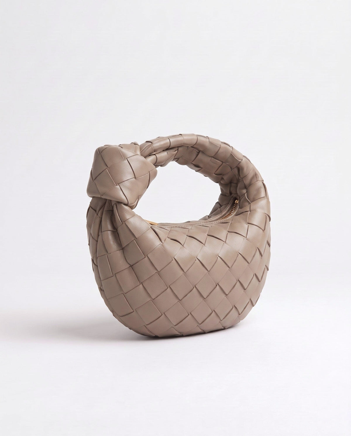 Knot Mini woven leather bag in Camel – three-quarter view