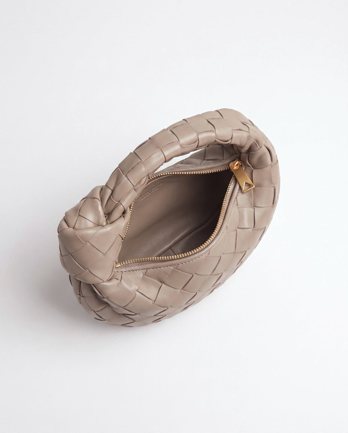 Knot Mini woven leather bag in Camel – inside view with the zip open