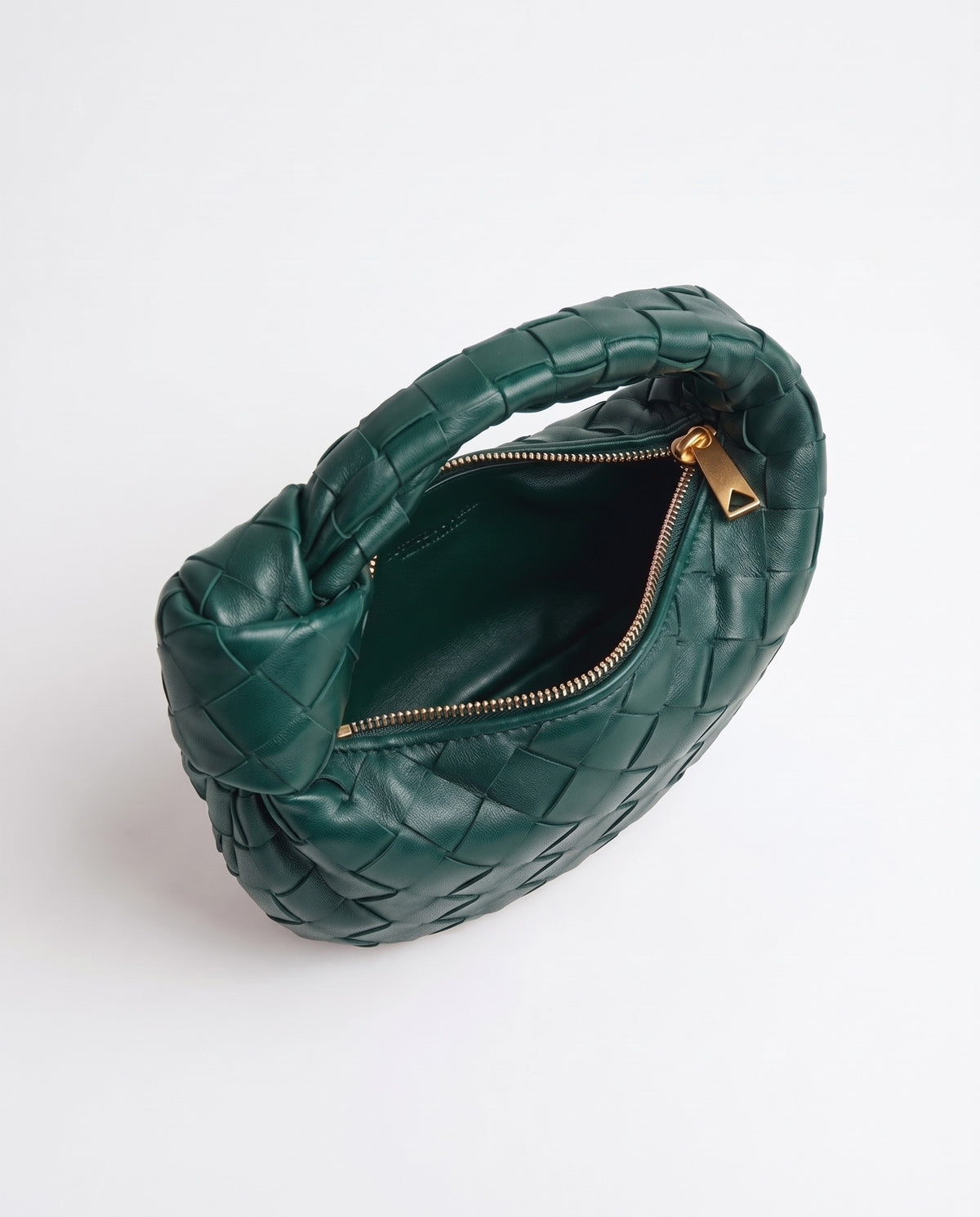 Knot Mini woven leather bag in Emerald – inside view with the zip open