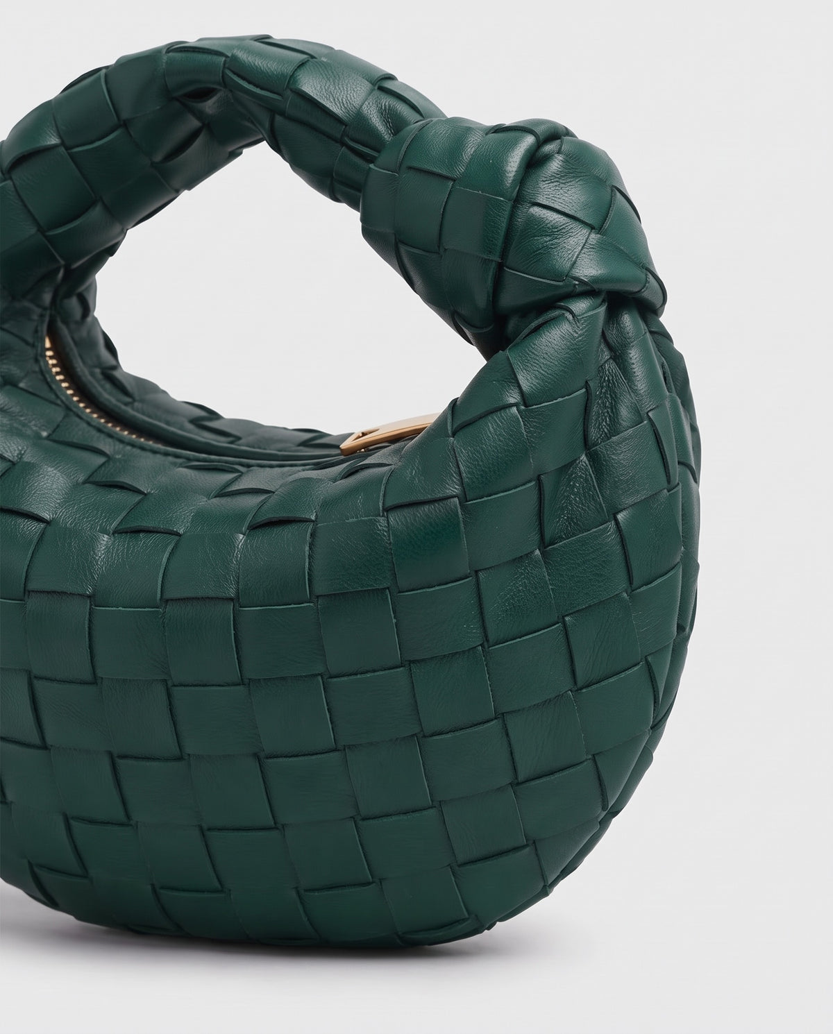 Knot Mini woven leather bag in Emerald – close-up of the woven leather