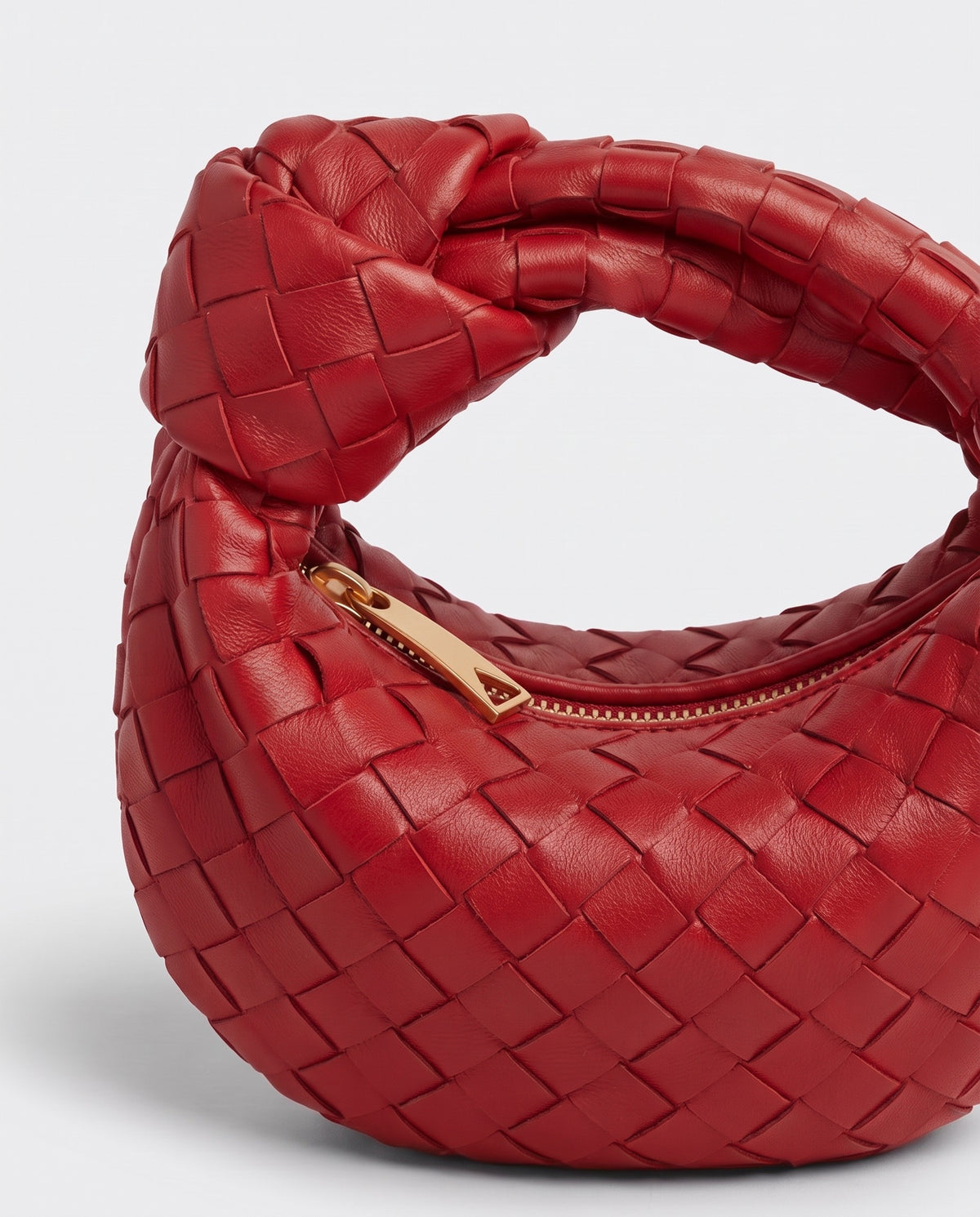 Knot Mini woven leather bag in Scarlet – close-up of the knotted handle