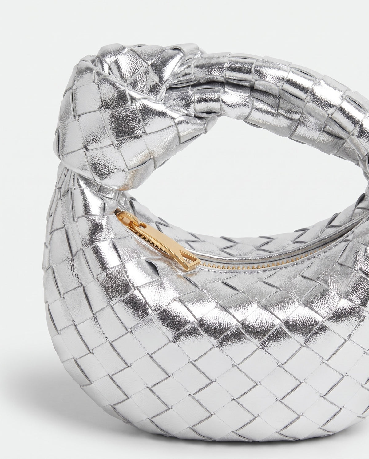 Knot Mini woven leather bag in Silver – close-up of the knotted handle