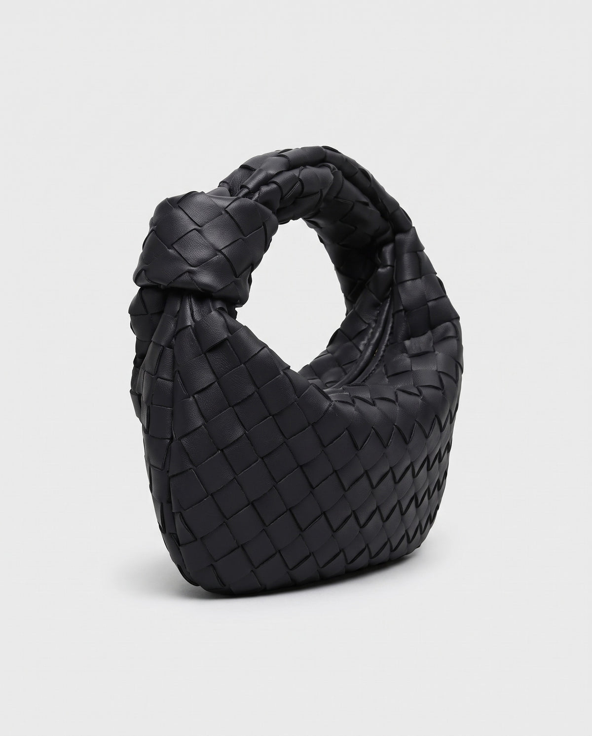 Knot Small woven leather bag in Black – three-quarter view