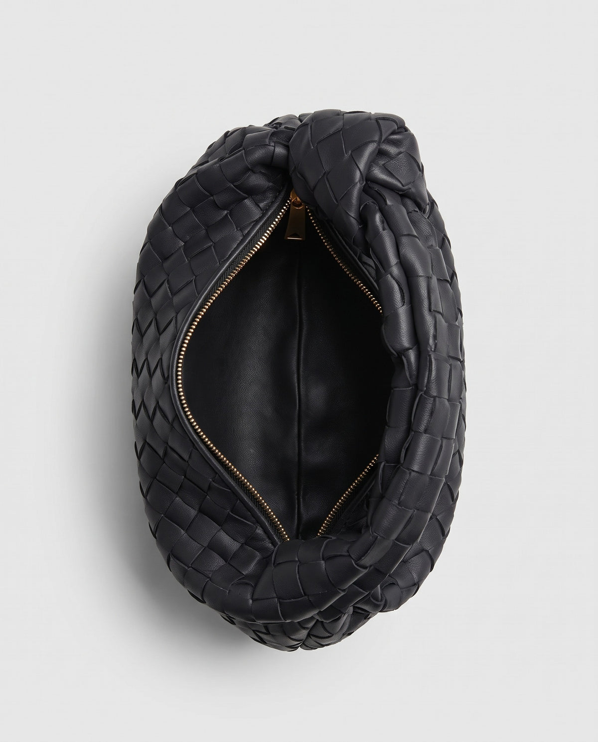 Knot Small woven leather bag in Black – inside view showing the lining and zip