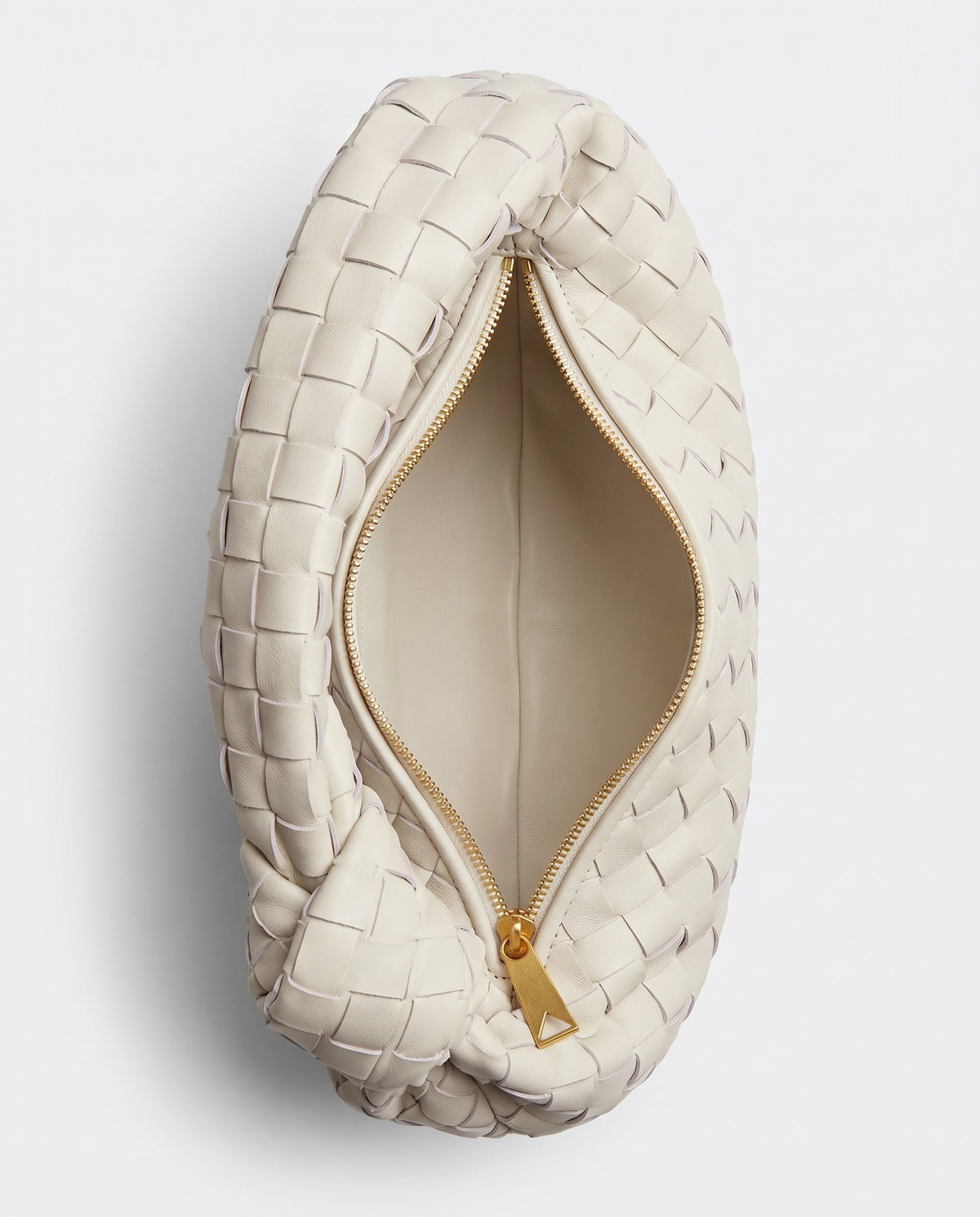 Knot Small woven leather bag in Chalk – inside view showing the lining and zip