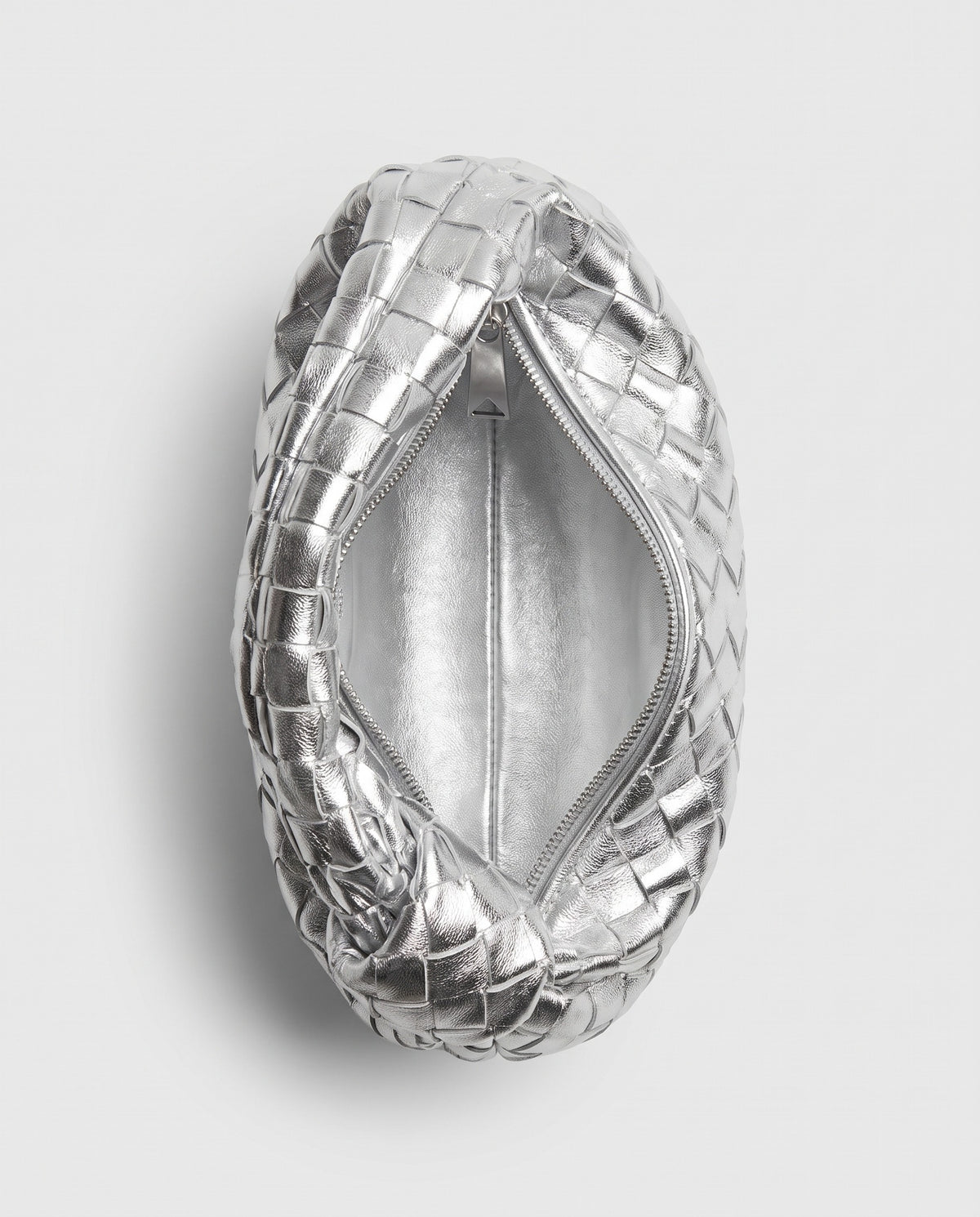 Knot Small woven leather bag in Silver – inside view showing the lining and zip