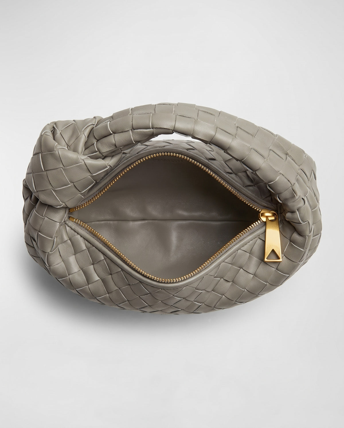 Knot Small woven leather bag in Stone – inside view showing the lining and zip