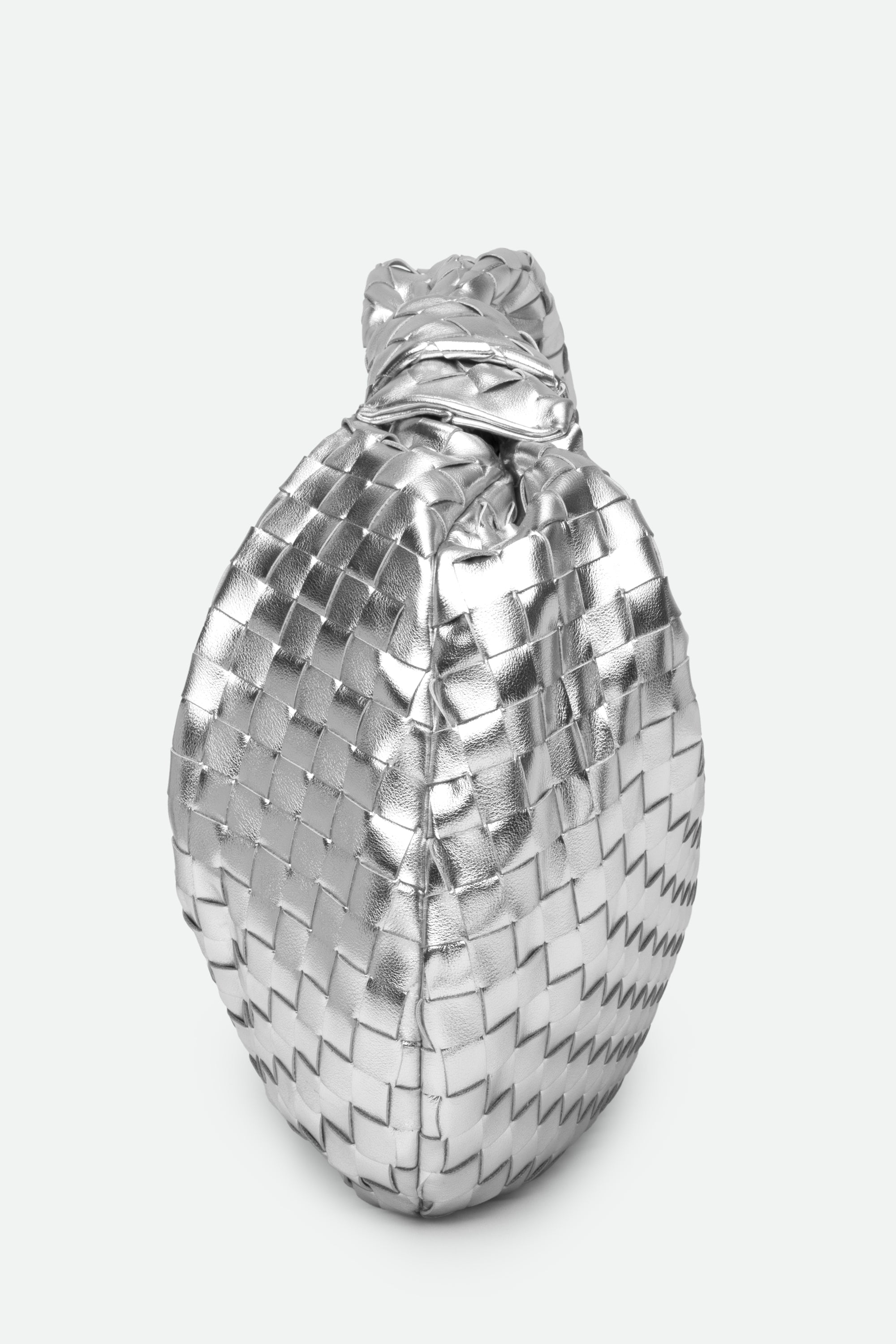 Large Knot Bag (Jodie) silver woven handbag standing upright with a knotted top on a white background.