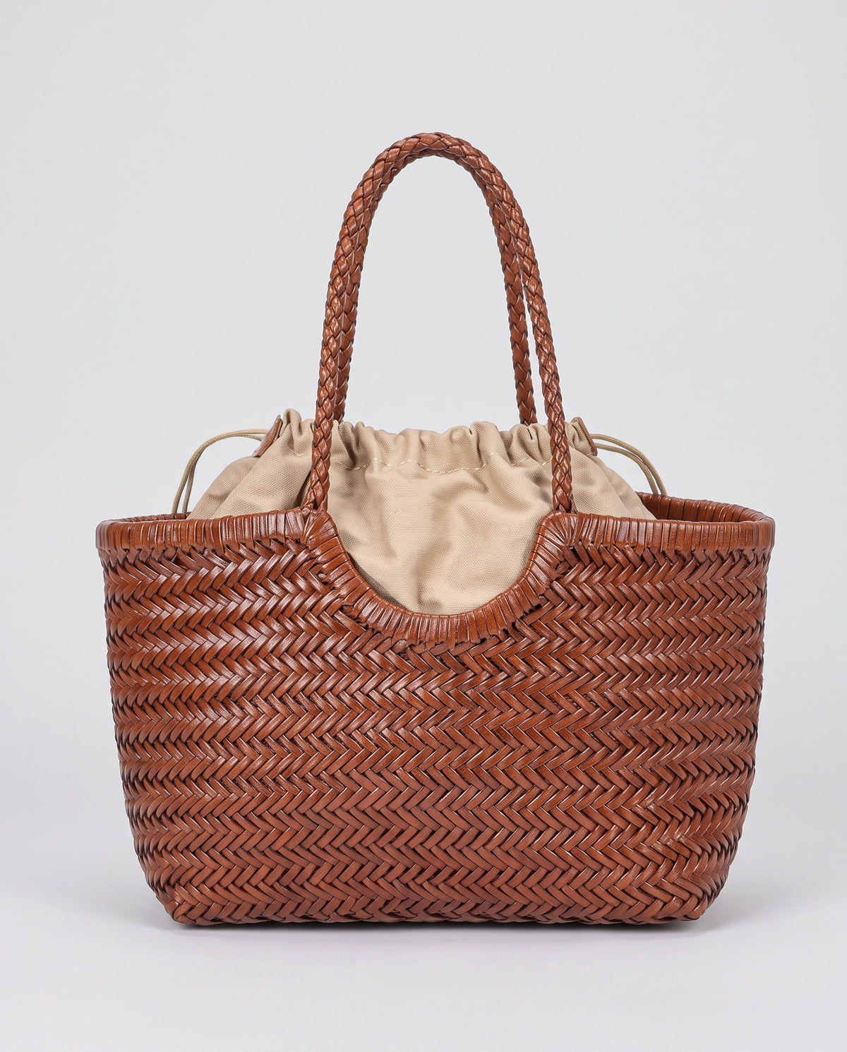 Hardware and handle detail on the Valentina Lecce bag in Cognac