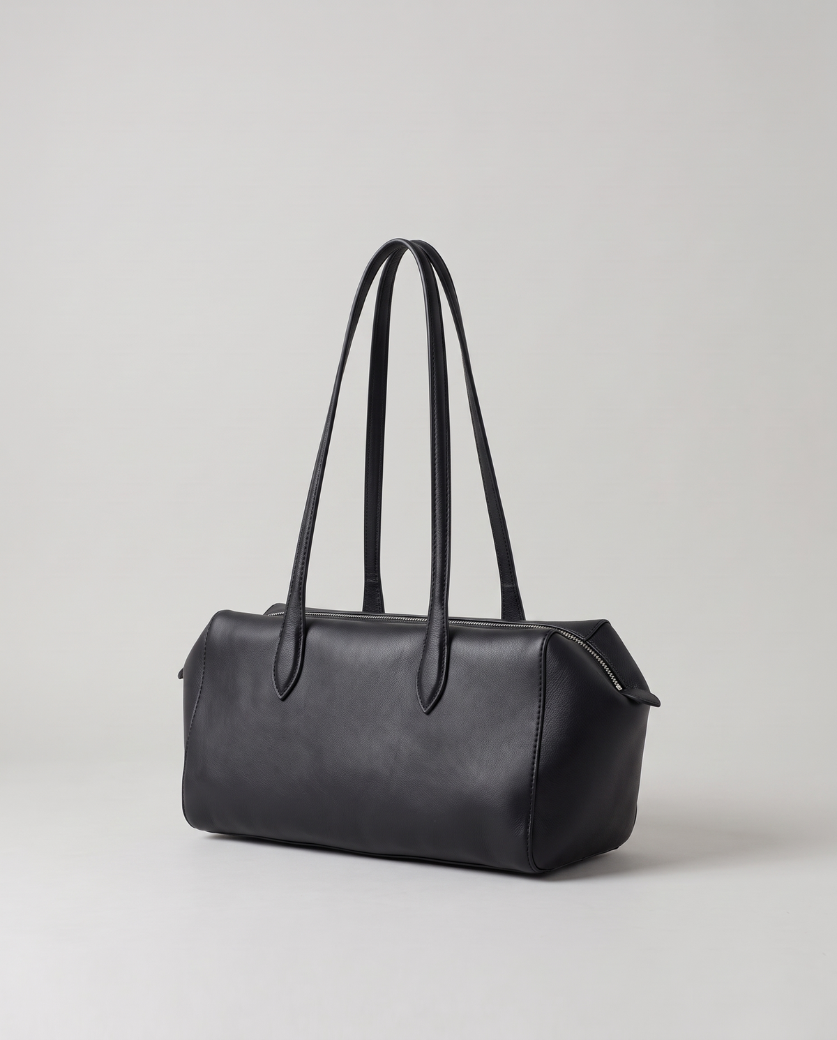 Lira leather shoulder bag in Black – three-quarter view