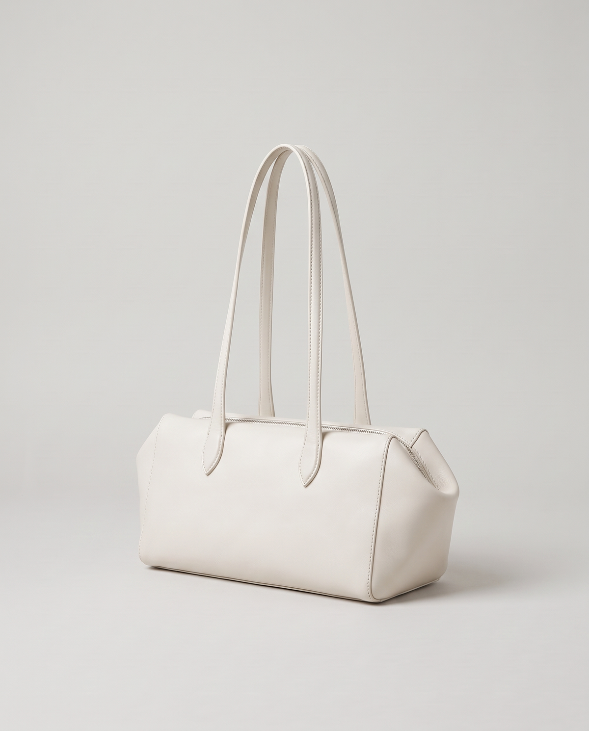 Lira leather shoulder bag in White – three-quarter view