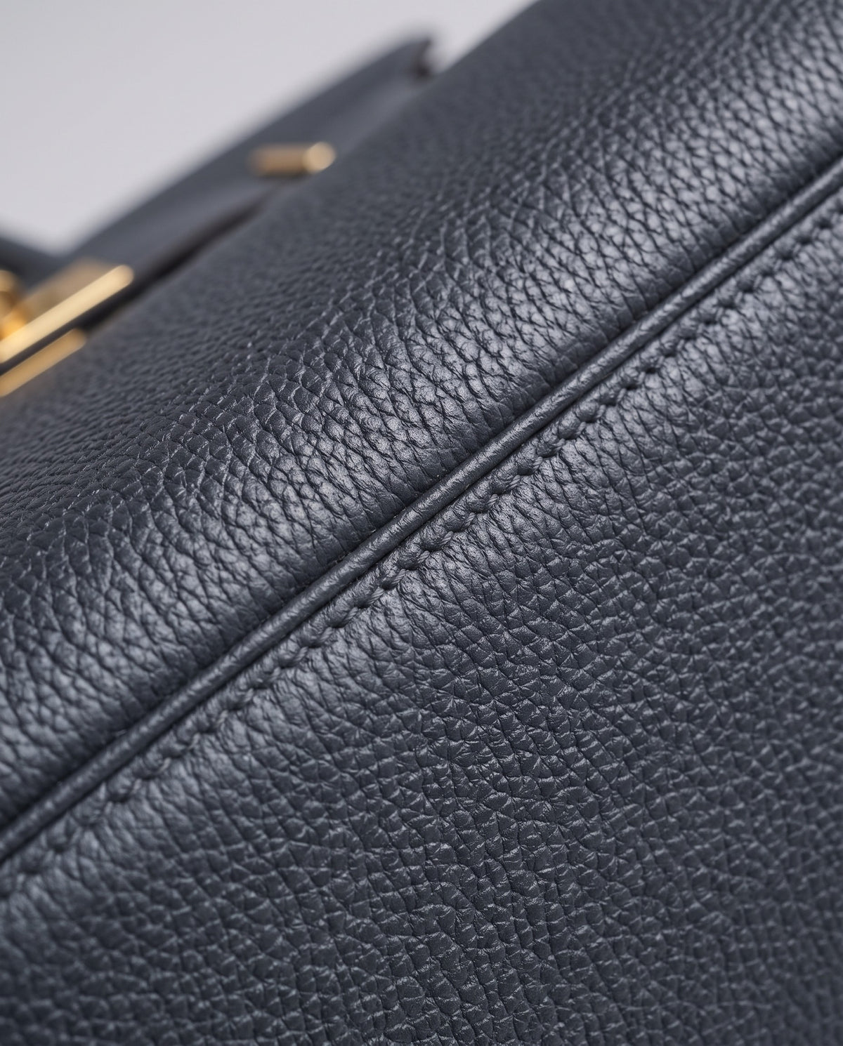 Lock Large leather top-handle bag in Charcoal – close-up of the pebbled leather and stitching