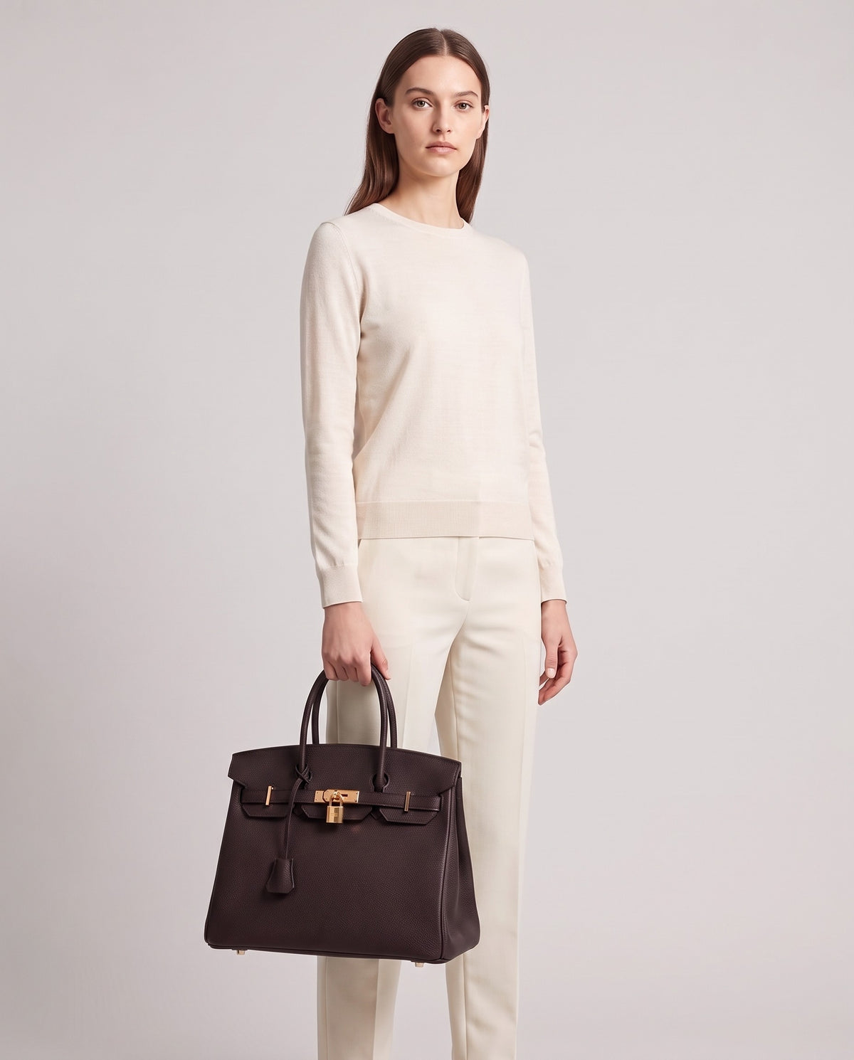 Lock Large leather top-handle bag in Espresso – model holding it, full length