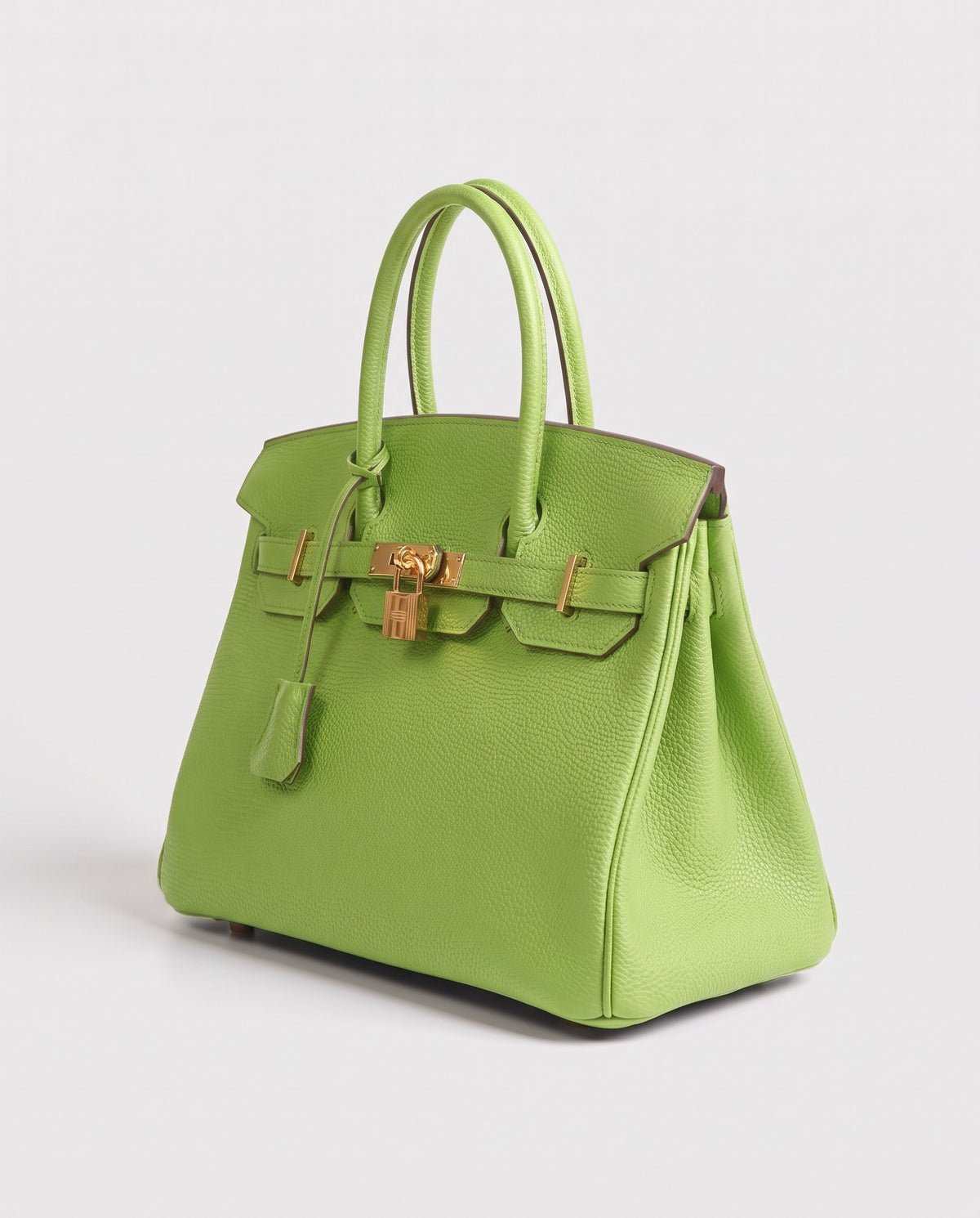 Lock Medium leather top-handle bag in Avocado – three-quarter view