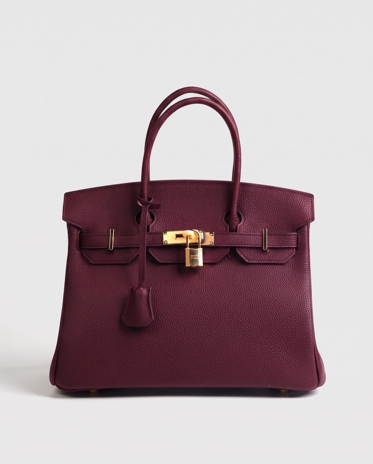 Lock Medium leather top-handle bag in Bordeaux – front view