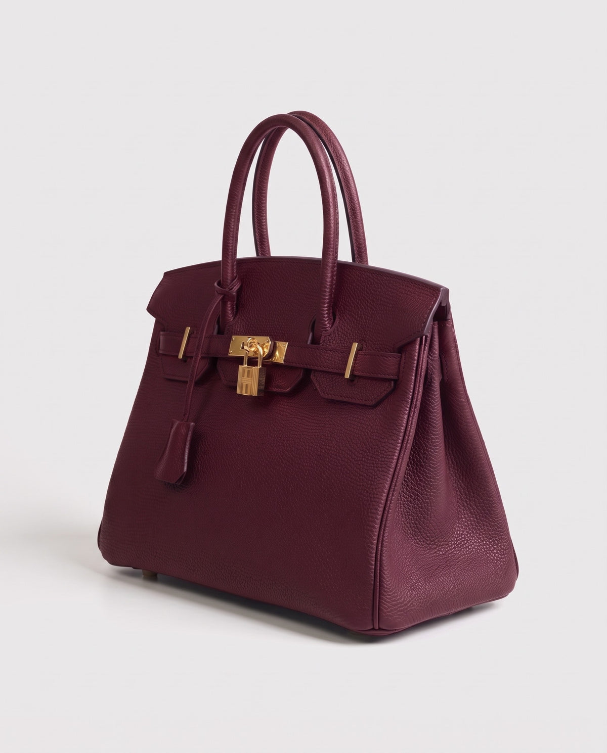 Lock Small leather top-handle bag in Bordeaux – three-quarter view