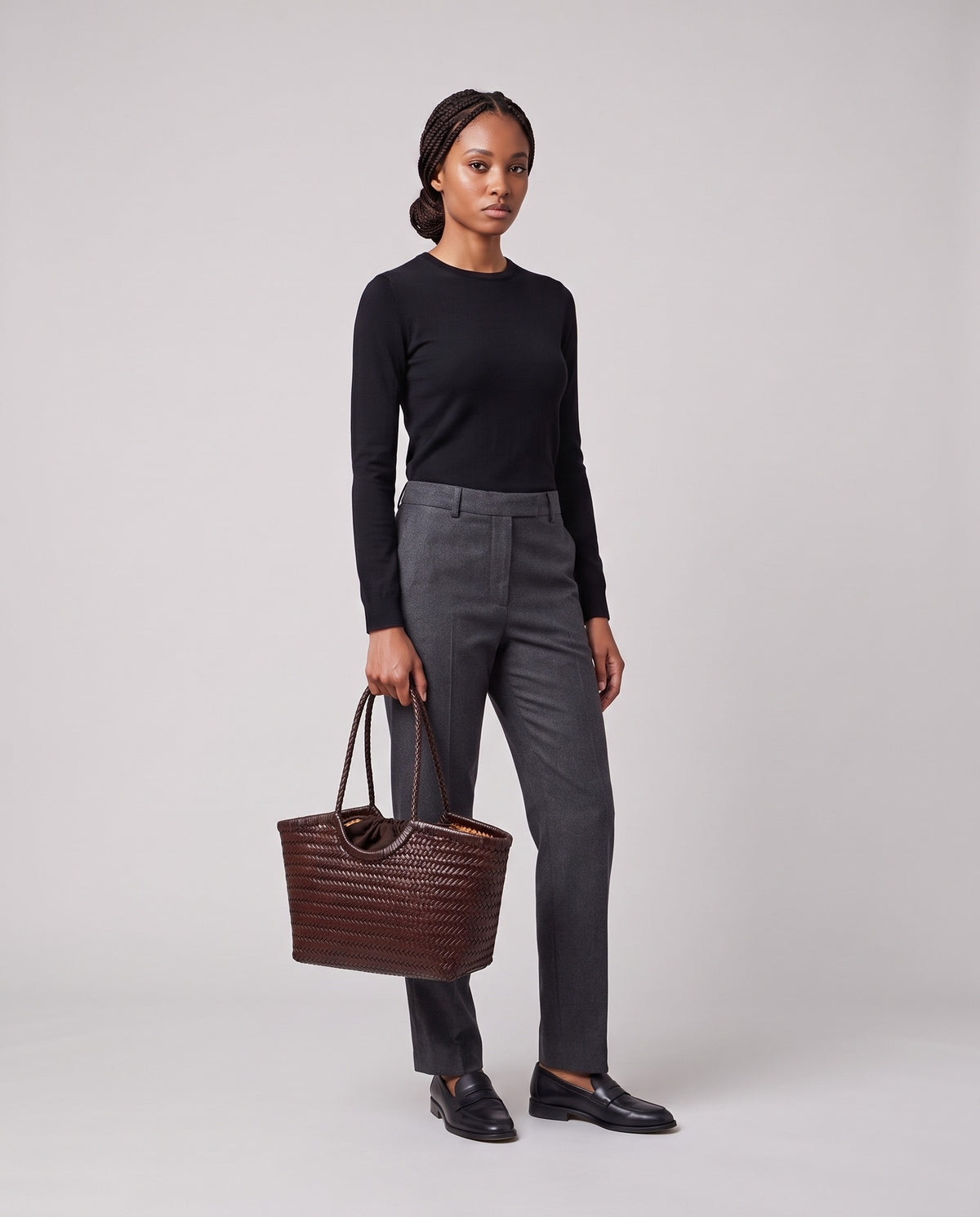 Model holding the Valentina Matera Large bag in Brown, full length