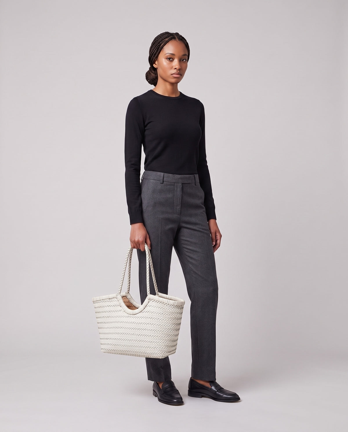 Model holding the Valentina Matera Large bag in White, full length