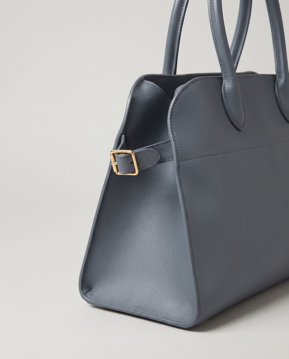 Milano Small top-handle bag in Slate – close-up of the handle and gold side buckle